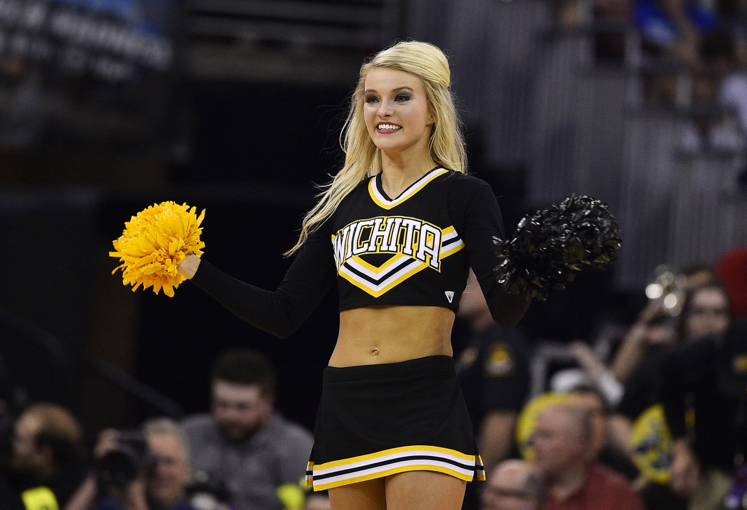 Mar 22, 2015; Omaha, NE, USA; Wichita State Shockers cheerleader performs against the Kansas Jayhawks during the second half in the third round of the 2015 NCAA Tournament at CenturyLink Center. Mandatory Credit: Jasen Vinlove-Imagn Images