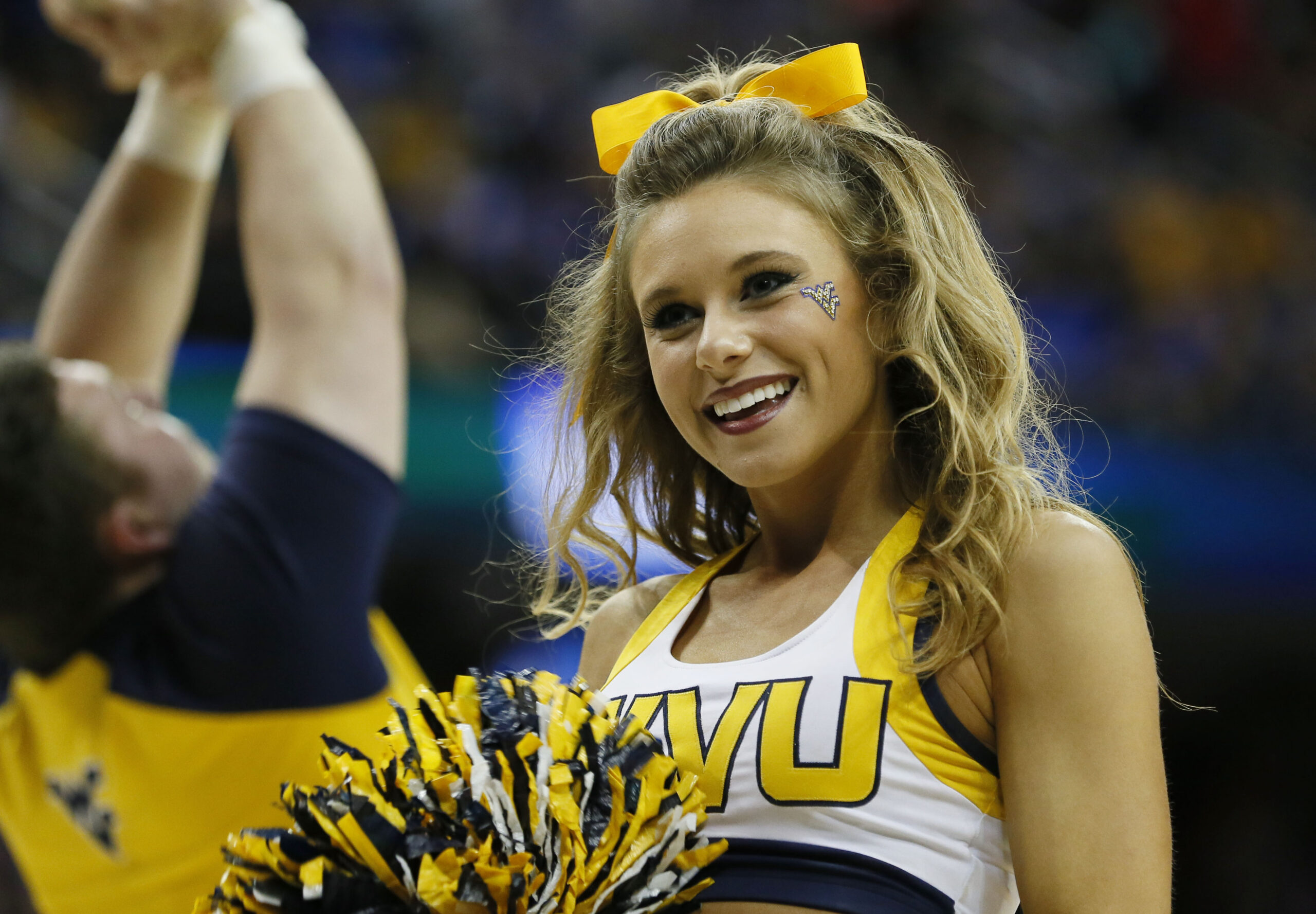 Mar 26, 2015; Cleveland, OH, USA; West Virginia Mountaineers cheerleader during the first half against the Kentucky Wildcats in the semifinals of the midwest regional of the 2015 NCAA Tournament at Quicken Loans Arena. Mandatory Credit: Rick Osentoski-Imagn Images