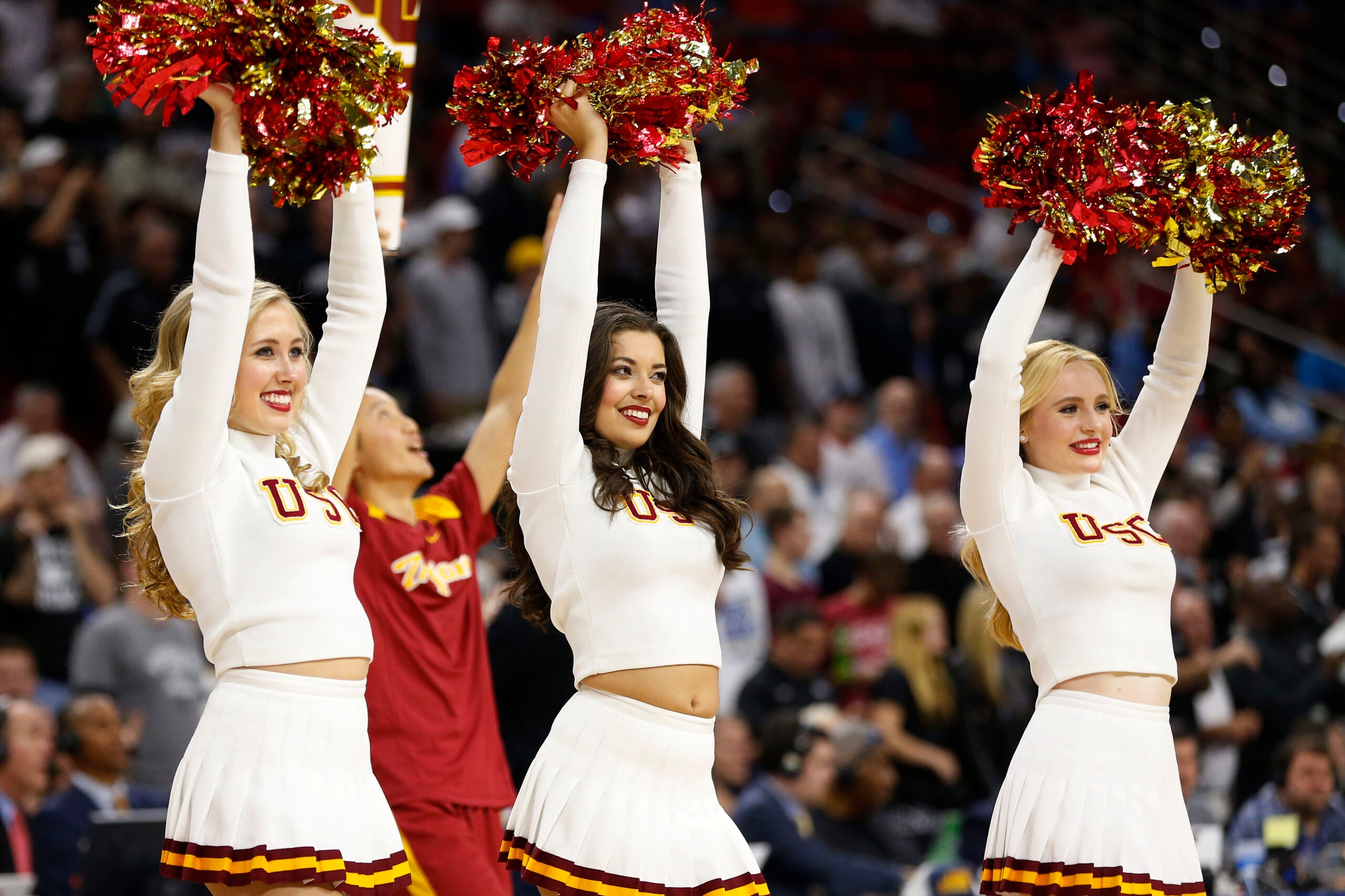 Mar 17, 2016; Raleigh, NC, USA; USC Trojans cheerleaders perform on the court prior to the game against the Providence Friars at PNC Arena. Mandatory Credit: Geoff Burke-Imagn Images