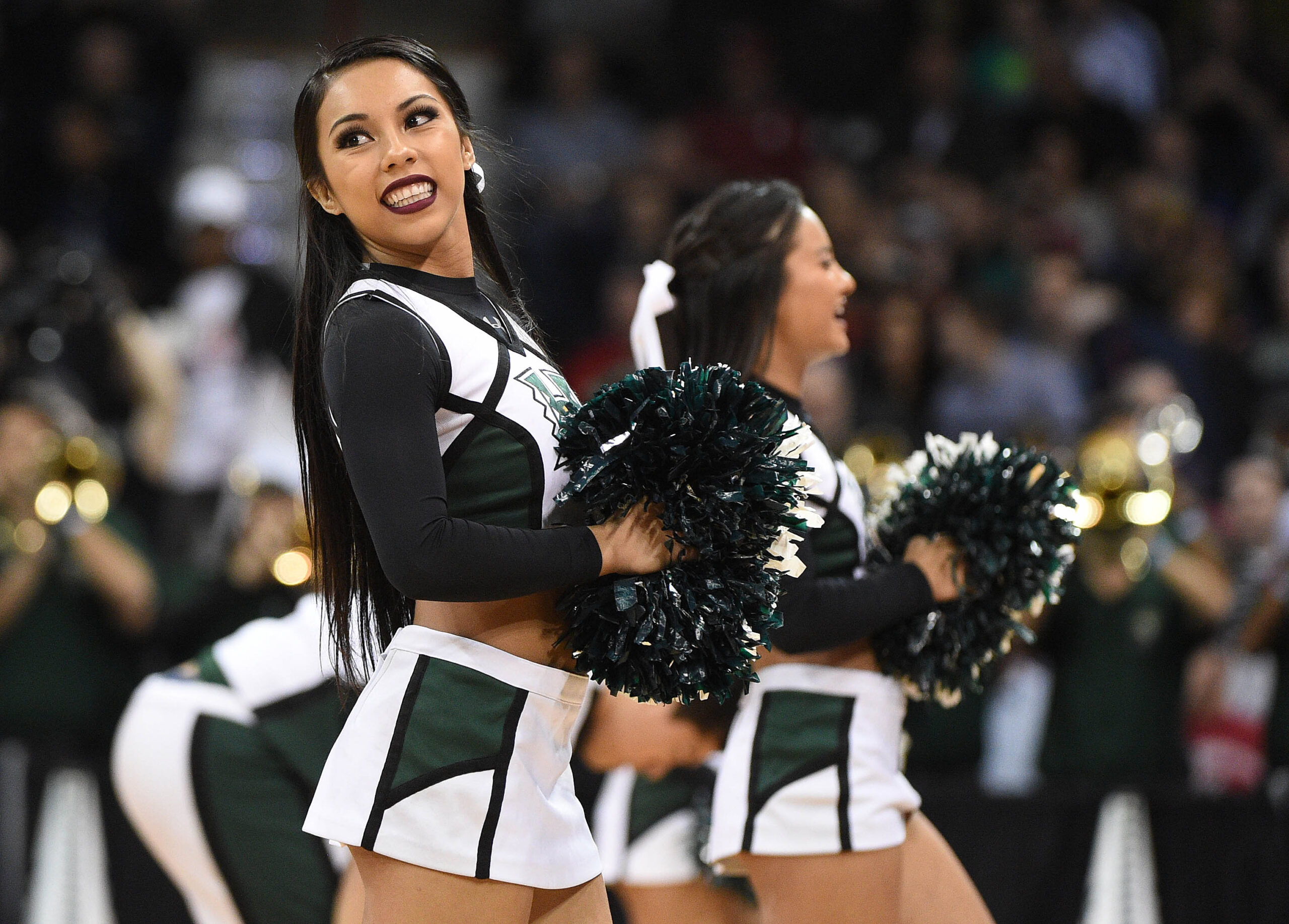 March 18, 2016; Spokane , WA, USA; Hawaii Rainbow Warriors cheerleaders perform during a stoppage in play during the first half of the first round of the 2016 NCAA Tournament at Spokane Veterans Memorial Arena. Mandatory Credit: Kyle Terada-Imagn Images
