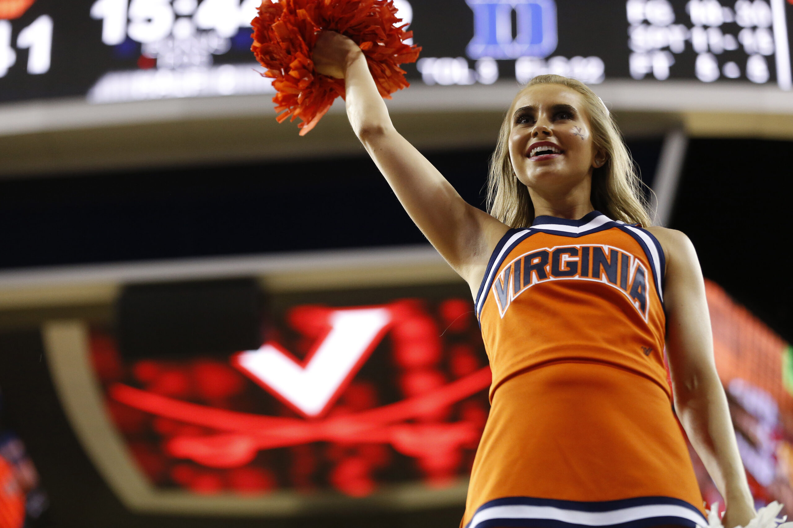 Feb 9, 2019; Charlottesville, VA, USA; A Virginia Cavaliers cheerleader cheers on the court during a timeout against the Duke Blue Devils in the second half at John Paul Jones Arena. The Blue Devils won 81-71. Mandatory Credit: Geoff Burke-Imagn Images