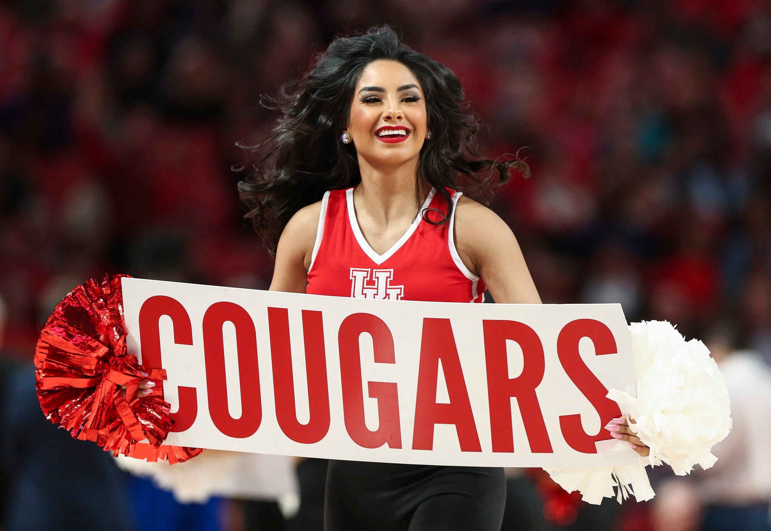 Feb 19, 2020; Houston, Texas, USA; Houston Cougars cheerleaders perform during the first half against the Tulsa Golden Hurricane at Fertitta Center. Mandatory Credit: Troy Taormina-Imagn Images