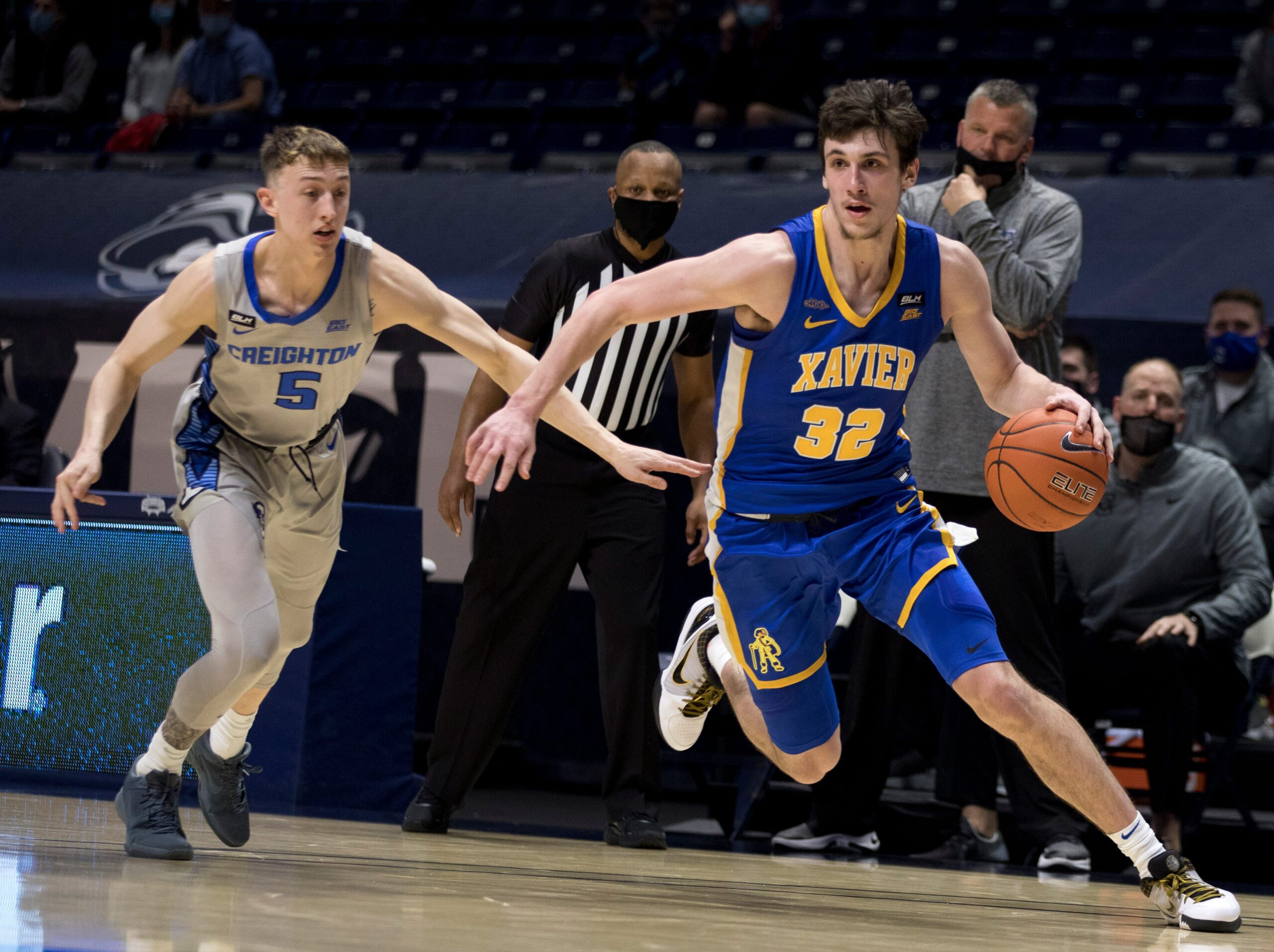 Xavier Musketeers forward Zach Freemantle (32) drives passed Creighton Bluejays guard Alex O'Connell (5) in the first half of the men's NCAA basketball game on Saturday, Feb. 27, 2021, at the Cintas Center in Cincinnati.

Xavier Musketeers Creighton Bluejays