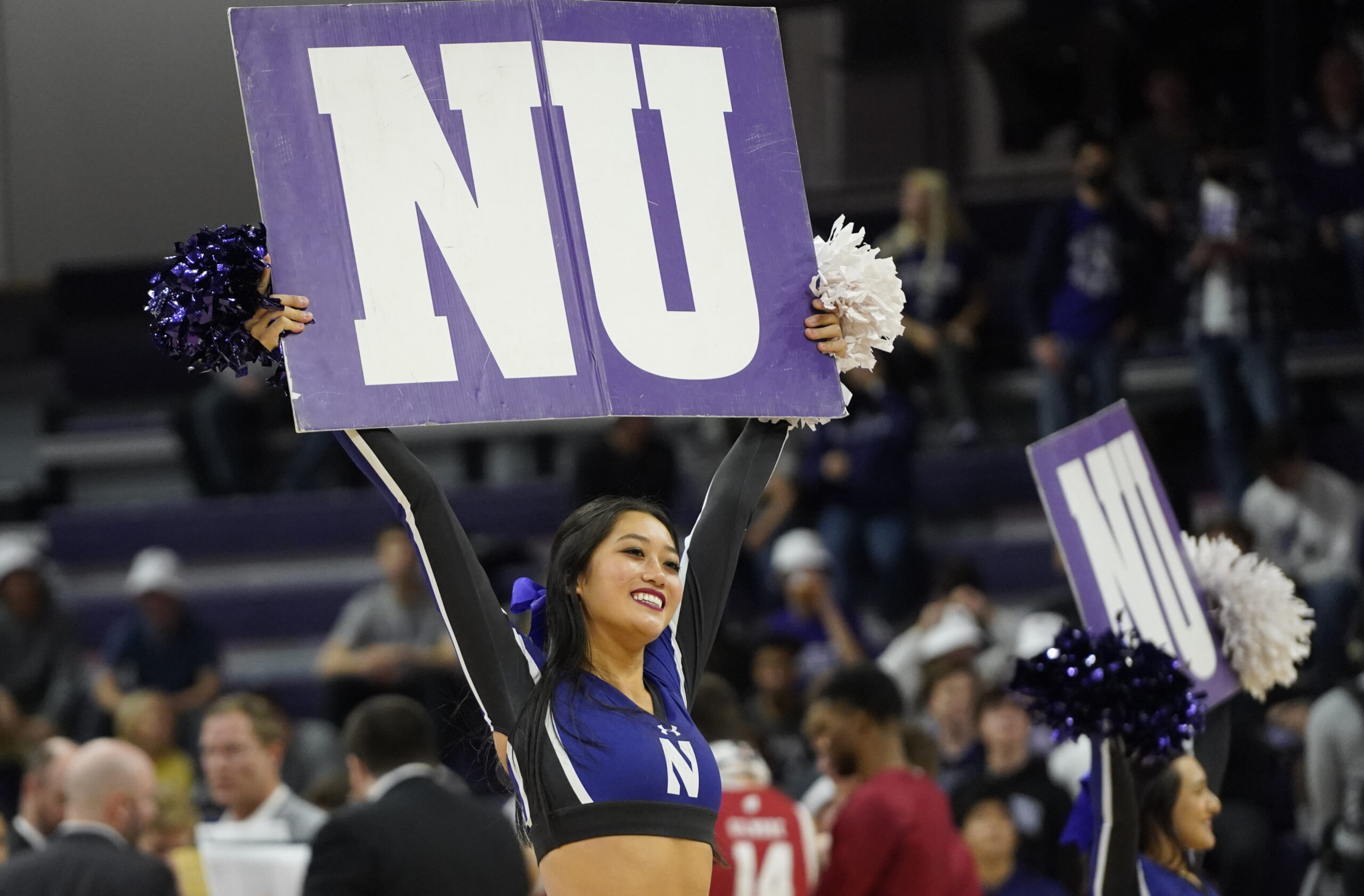 Jan 23, 2023; Evanston, Illinois, USA; A Northwestern Wildcats cheerleader during the first half against the Wisconsin Badgers at Welsh-Ryan Arena. Mandatory Credit: David Banks-Imagn Images