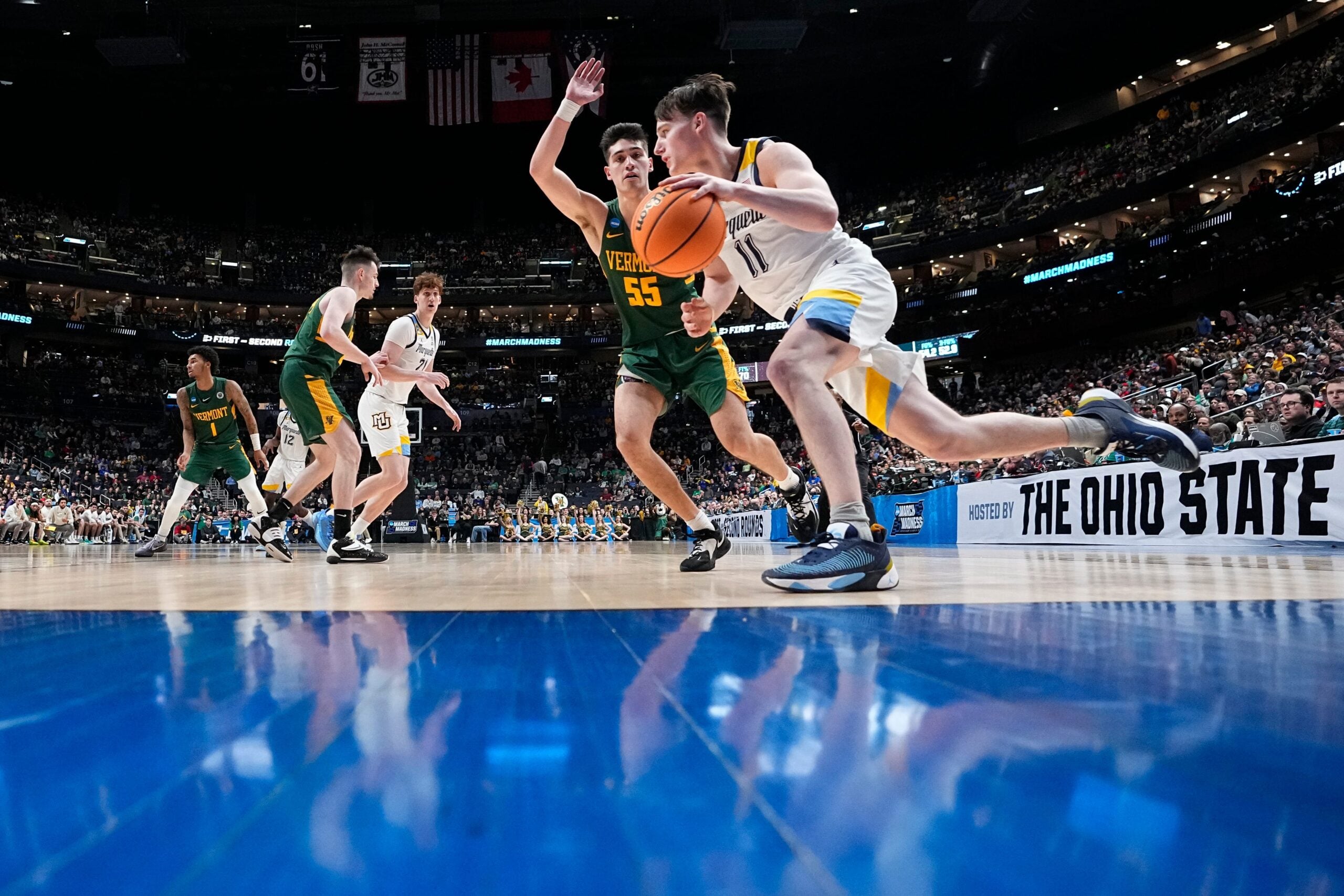 Mar 17, 2023; Columbus, Ohio, USA;  Marquette Golden Eagles guard Tyler Kolek (11) drives past Vermont Catamounts guard Robin Duncan (55) during the first round of the NCAA men   s basketball tournament at Nationwide Arena. Marquette won 78-61. Mandatory Credit: Adam Cairns-The Columbus Dispatch

Basketball Ncaa Men S Basketball Tournament