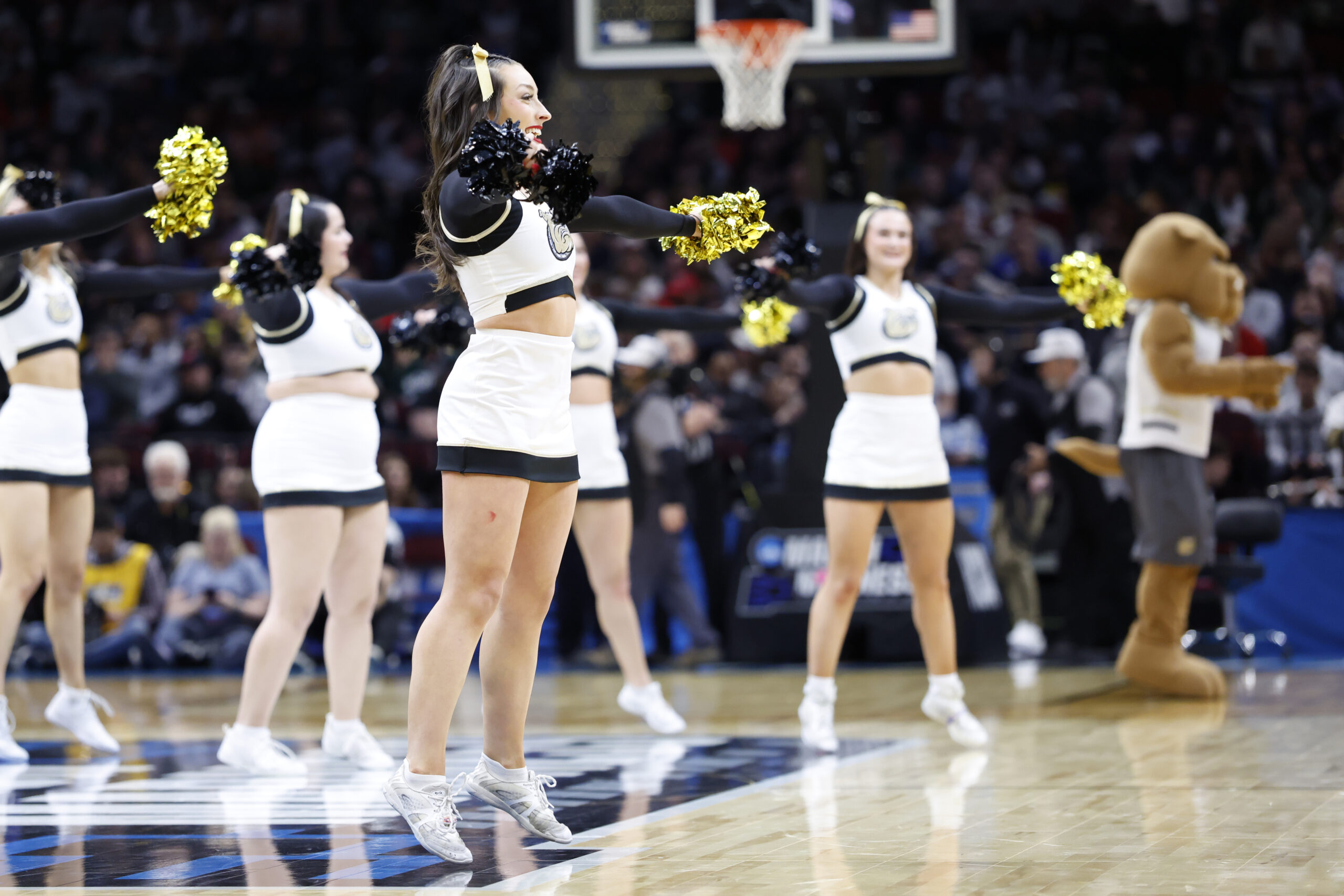 Mar 21, 2025; Cleveland, OH, USA; Bryant University Bulldogs cheerleaders perform in the first half against the Michigan State Spartans during the NCAA Tournament First Round at Rocket Mortgage Fieldhouse. Mandatory Credit: Rick Osentoski-Imagn Images