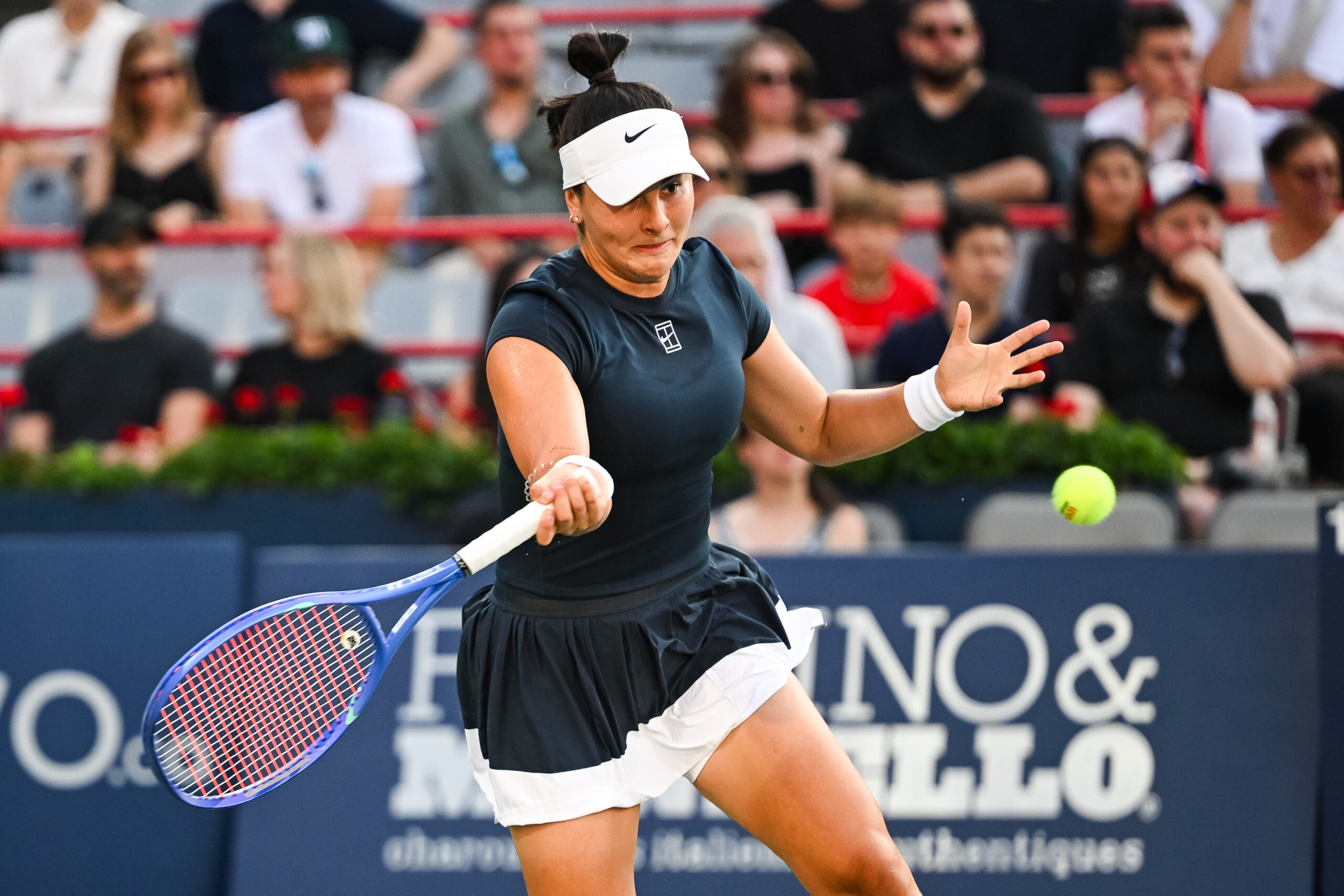 Jul 27, 2025; Montreal, QC, Canada; Bianca Andreescu (CAN) returns the ball to Barbora Krejcikova (CZE) in first round play at IGA Stadium. Mandatory Credit: David Kirouac-Imagn Images