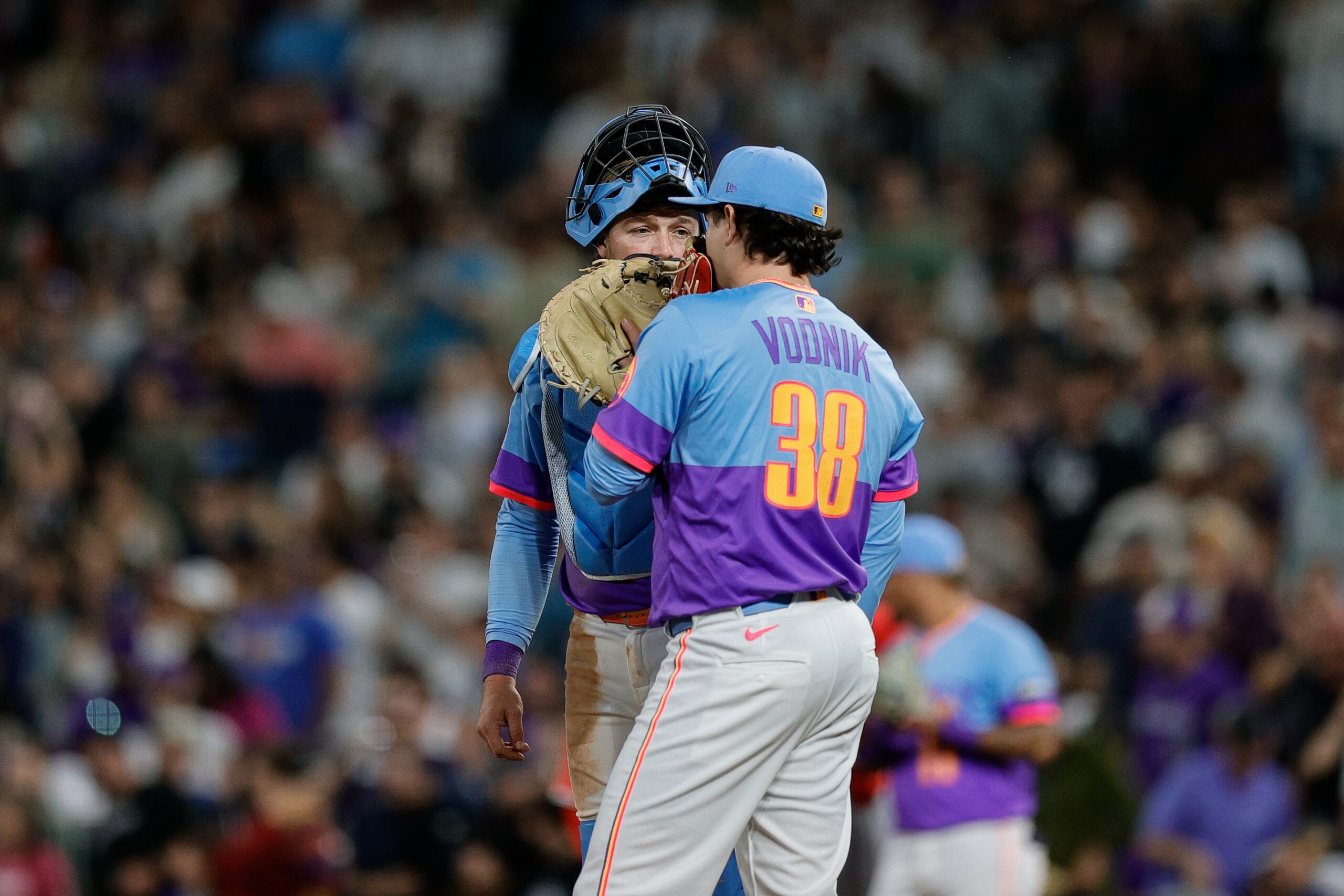 Sep 19, 2025; Denver, Colorado, USA; Colorado Rockies catcher Hunter Goodman (15) talks with relief pitcher Victor Vodnik (38) in the ninth inning against the Los Angeles Angels at Coors Field. Mandatory Credit: Isaiah J. Downing-Imagn Images
