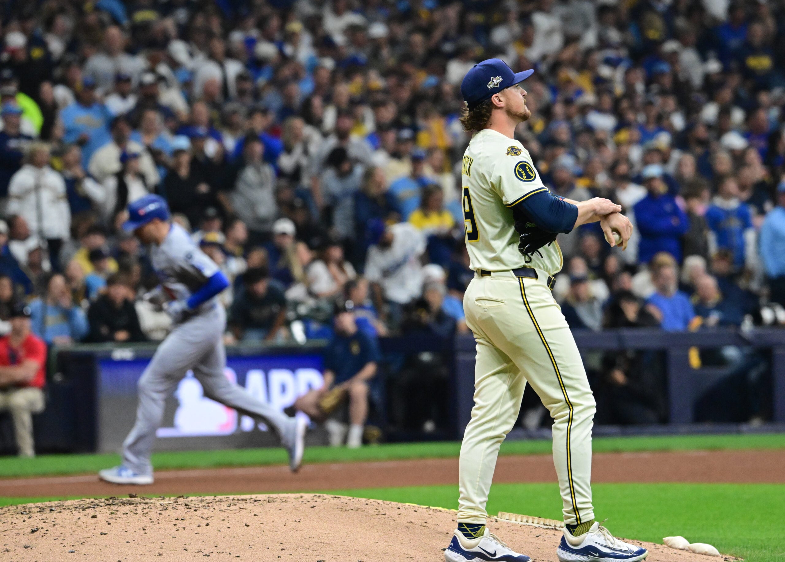 Oct 13, 2025; Milwaukee, Wisconsin, USA: Milwaukee Brewers relief pitcher Chad Patrick (39) reacts after giving up a home run to Los Angeles Dodgers first baseman Freddie Freeman (5) during the sixth inning during game one of the NLCS round for the 2025 MLB playoffs at American Family Field. Mandatory Credit: Benny Sieu-Imagn Images