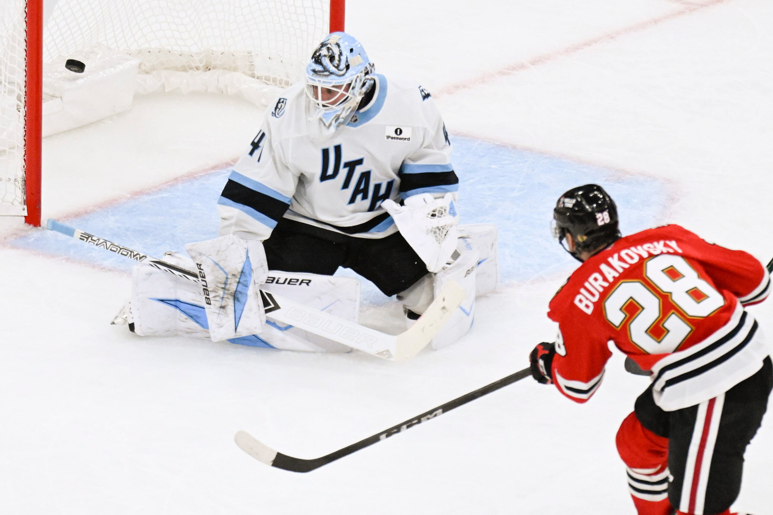 Oct 13, 2025; Chicago, Illinois, USA; Chicago Blackhawks left wing Andre Burakovsky (28) scores past Utah Mammoth goaltender Vitek Vanecek (41) during the third period at United Center. Mandatory Credit: Matt Marton-Imagn Images