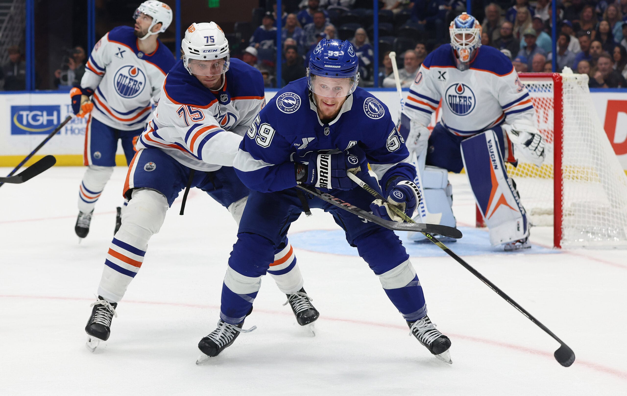 Nov 20, 2025; Tampa, Florida, USA; Edmonton Oilers defenseman Alec Regula (75) defends against Tampa Bay Lightning center Jake Guentzel (59) during the first period at Benchmark International Arena. Mandatory Credit: Kim Klement Neitzel-Imagn Images