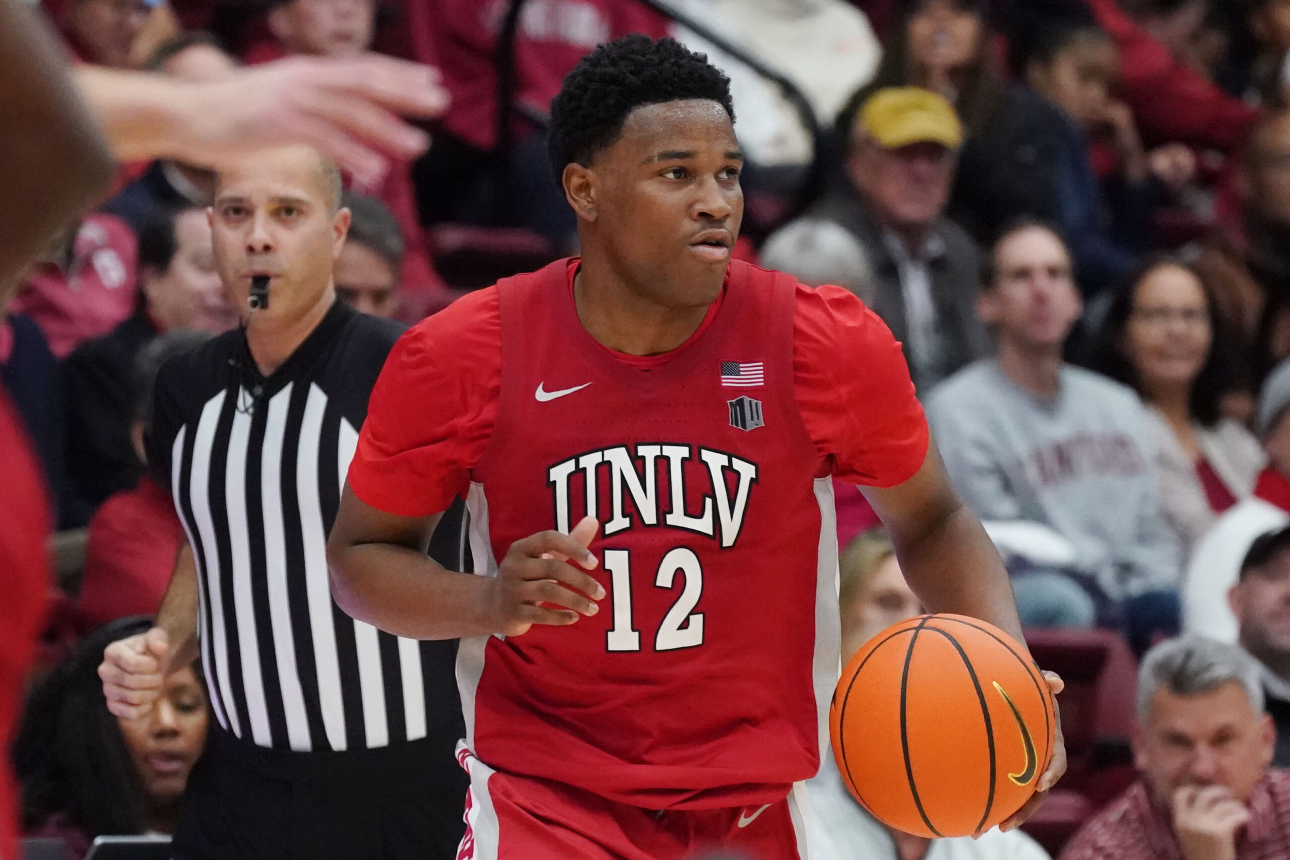 Dec 7, 2025; Stanford, California, USA;  UNLV Runnin' Rebels guard Issac Williamson (12) dribbles upcourt against the Stanford Cardinal in the second half at Maples Pavilion. Mandatory Credit: David Gonzales-Imagn Images