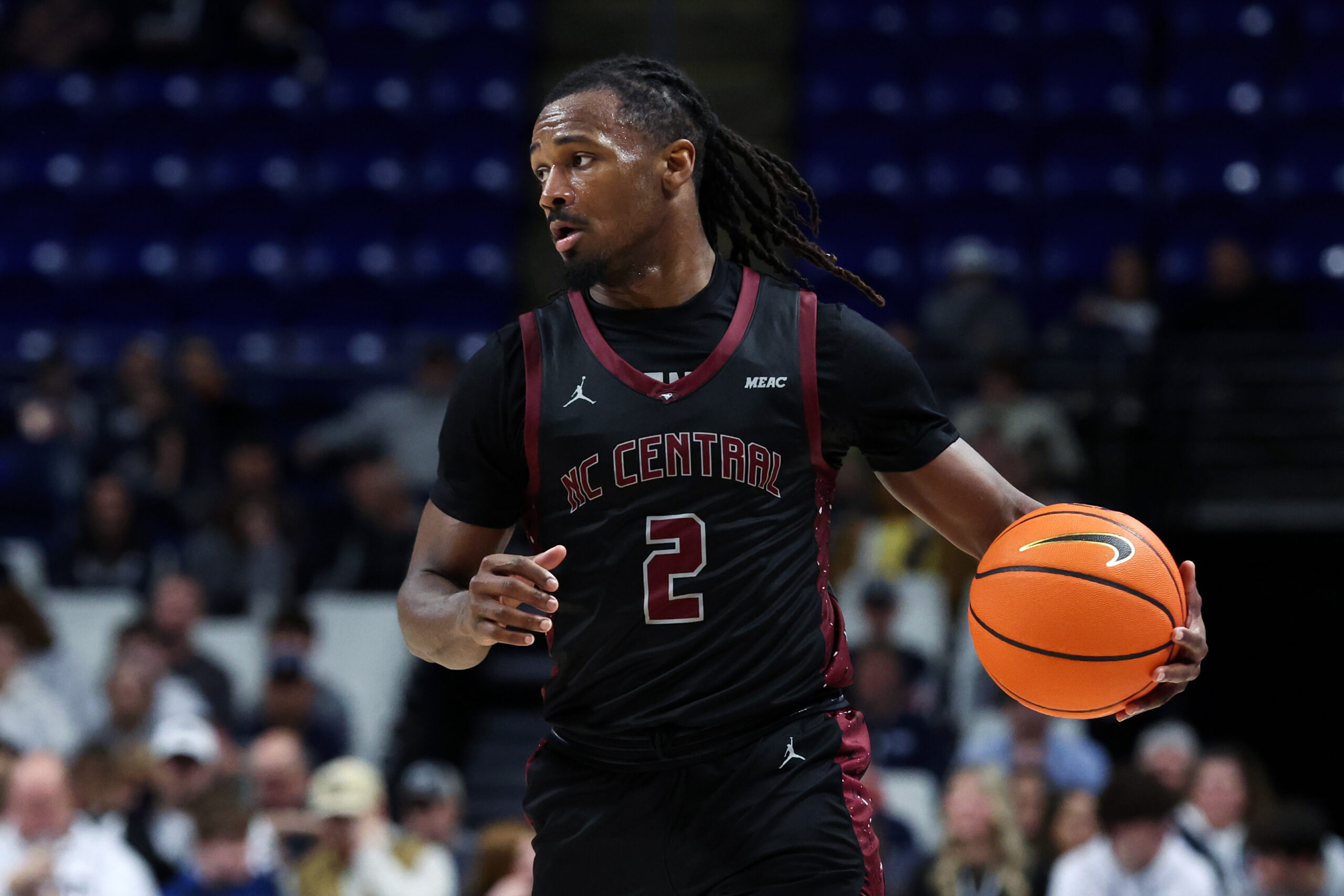 Dec 29, 2025; University Park, Pennsylvania, USA; North Carolina Central Eagles guard Dionte Johnson (2) moves the ball up the court during the second half against the Penn State Nittany Lions at Bryce Jordan Center. Mandatory Credit: Matthew O'Haren-Imagn Images
