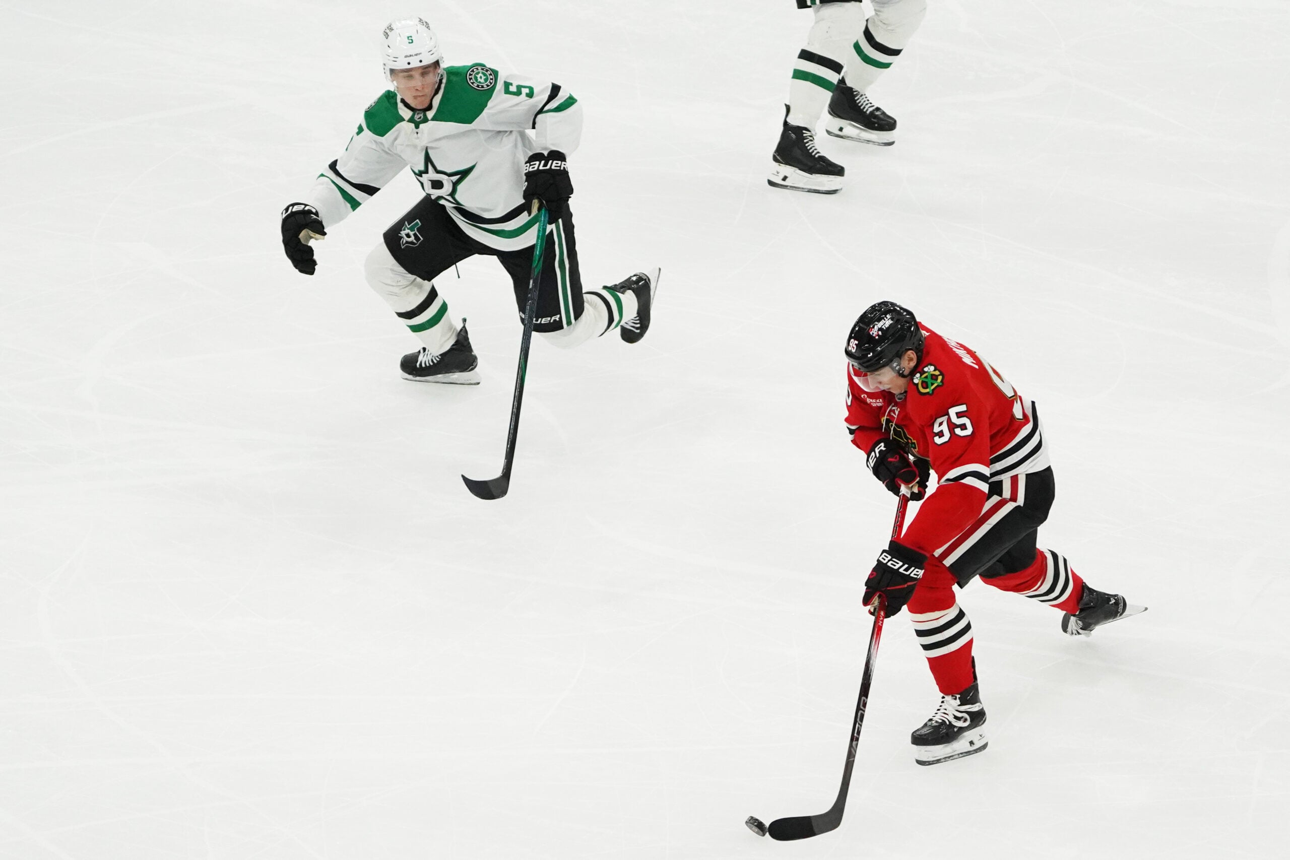 Jan 1, 2026; Chicago, Illinois, USA; Dallas Stars defenseman Nils Lundkvist (5) defends Chicago Blackhawks right wing Ilya Mikheyev (95) during the third period at United Center. Mandatory Credit: David Banks-Imagn Images