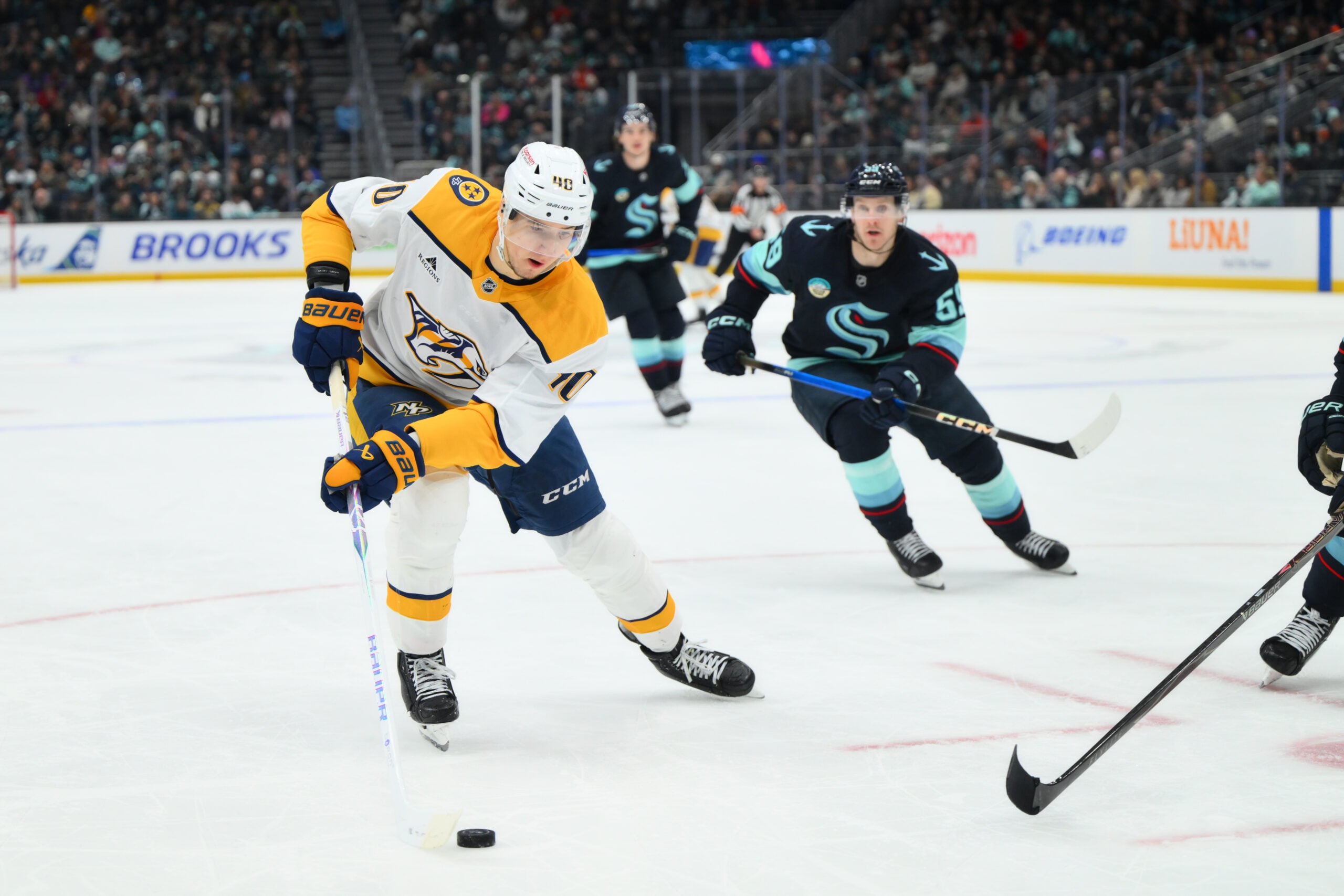 Jan 1, 2026; Seattle, Washington, USA; Nashville Predators center Fedor Svechkov (40) plays the puck during the third period against the Seattle Kraken at Climate Pledge Arena. Mandatory Credit: Steven Bisig-Imagn Images