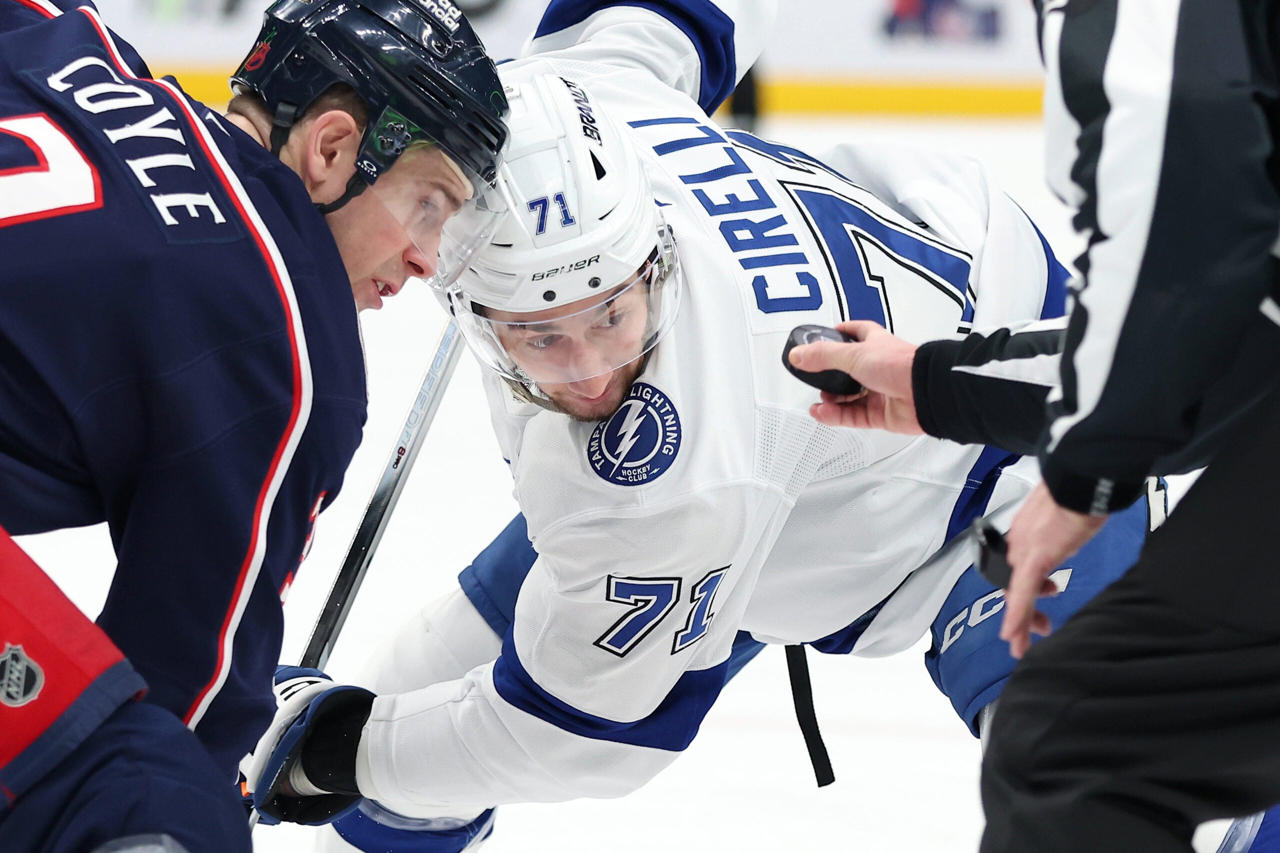 Jan 24, 2026; Columbus, Ohio, USA;  Tampa Bay Lightning center Anthony Cirelli (71) looks at the puck as he faces off with Columbus Blue Jackets center Charlie Coyle (3) during the first period at Nationwide Arena. Mandatory Credit: Joseph Maiorana-Imagn Images