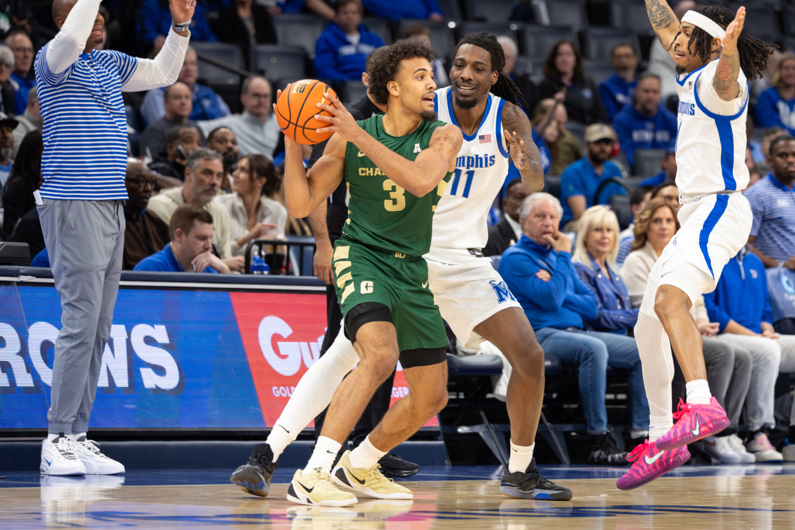 Feb 8, 2026; Memphis, Tennessee, USA; Charlotte 49ers guard Ben Bradford (3) handles the ball against Memphis Tigers forward Aaron Bradshaw (11) during the first half at FedExForum. Mandatory Credit: Wesley Hale-Imagn Images