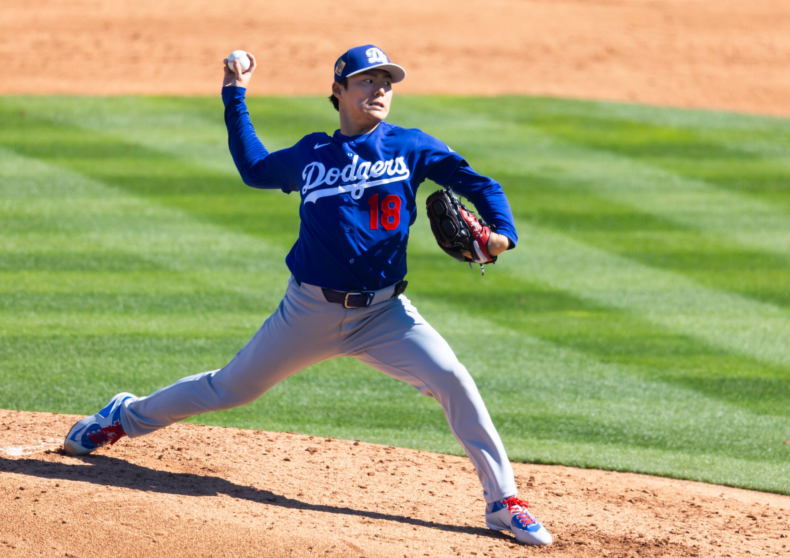 Feb 21, 2026; Tempe, Arizona, USA; Los Angeles Dodgers pitcher Yoshinobu Yamamoto against the Los Angeles Angels during a spring training game at Tempe Diablo Stadium. Mandatory Credit: Mark J. Rebilas-Imagn Images