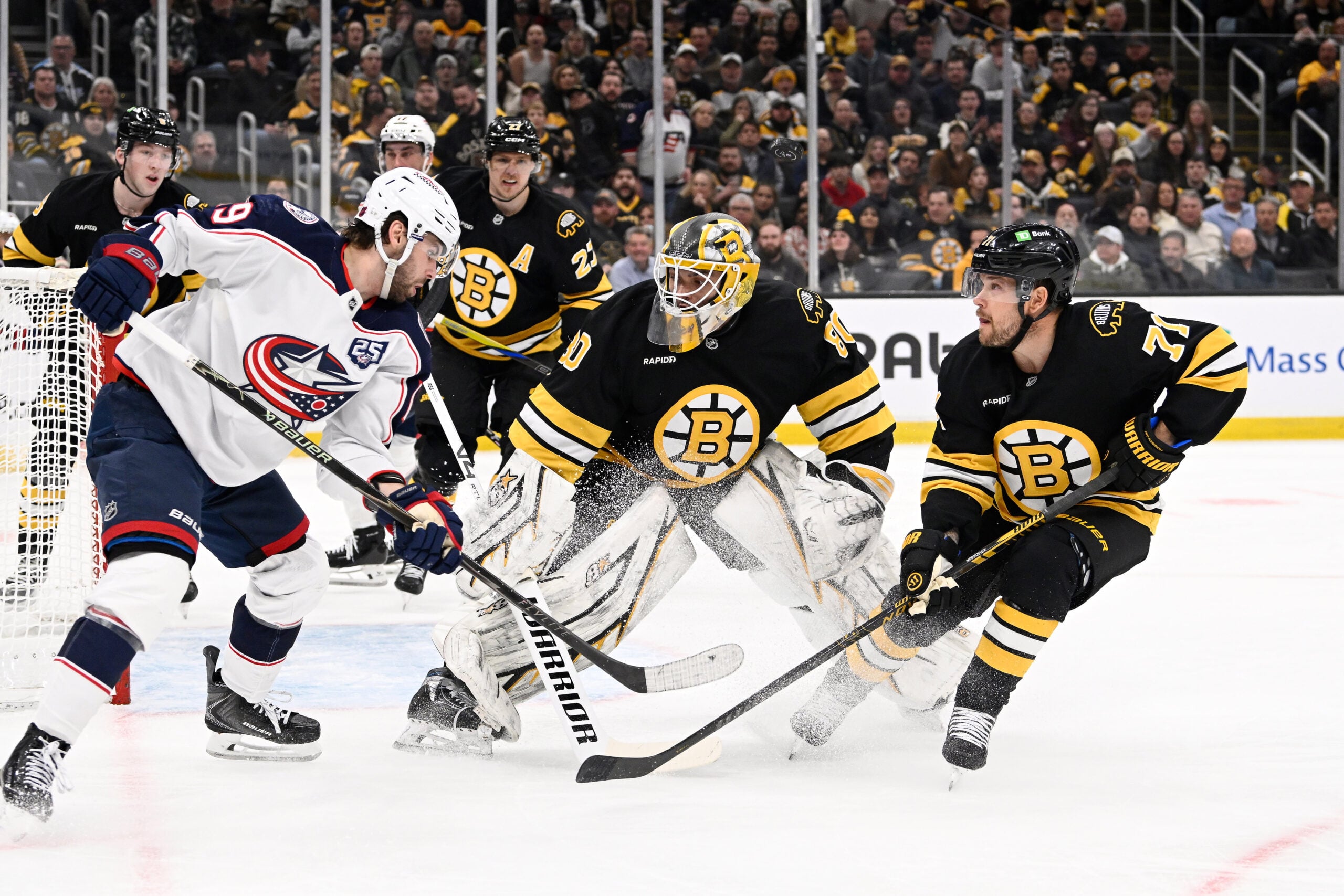 Feb 26, 2026; Boston, Massachusetts, USA; Columbus Blue Jackets center Adam Fantilli (19) shoots the puck over the head of Boston Bruins goaltender Michael DiPietro (80) during the second period at TD Garden. Mandatory Credit: Eric Canha-Imagn Images