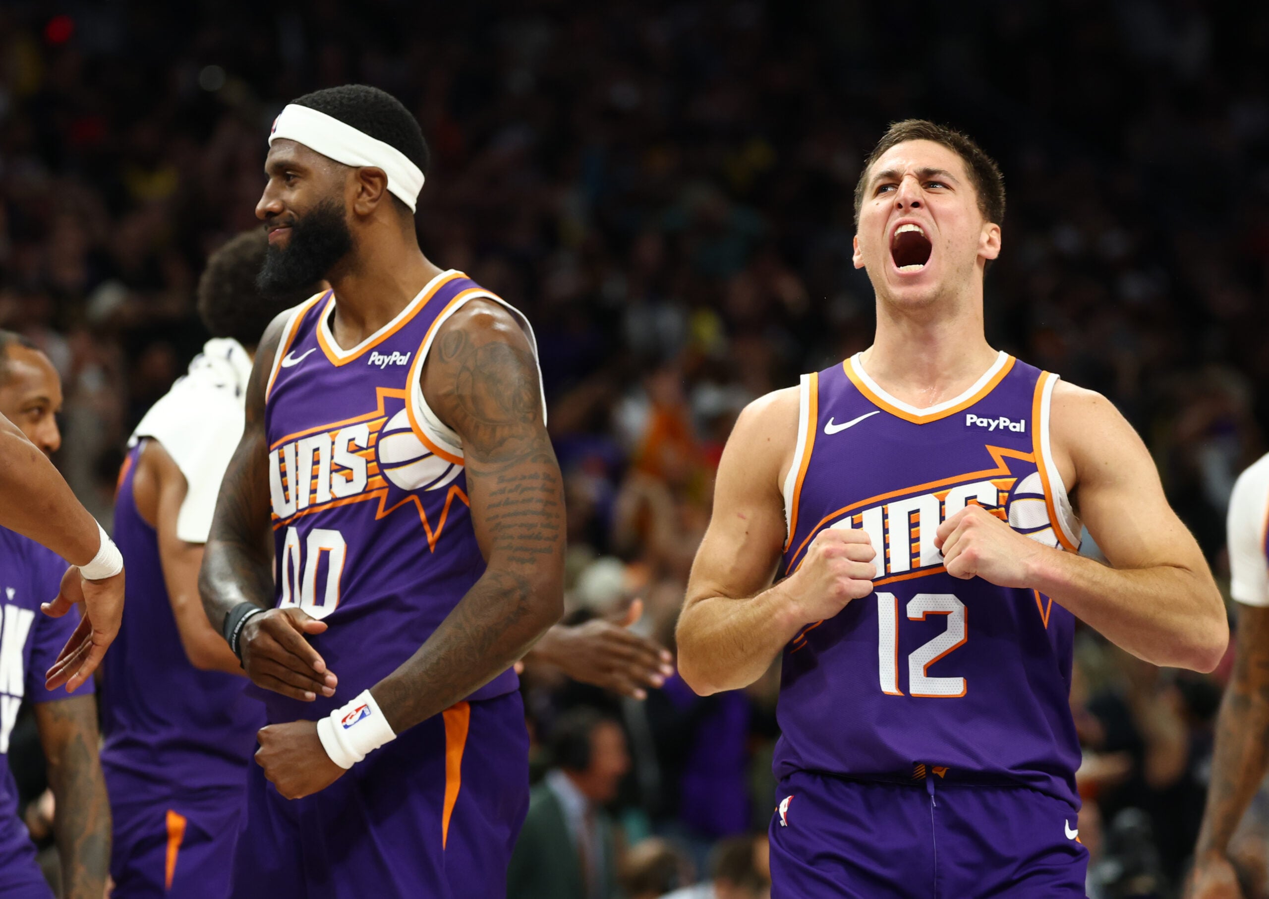 Feb 26, 2026; Phoenix, Arizona, USA; Phoenix Suns forward Royce O'Neale (00) celebrates with guard Collin Gillespie (12) against the Los Angeles Lakers in the second half at Mortgage Matchup Center. Mandatory Credit: Mark J. Rebilas-Imagn Images