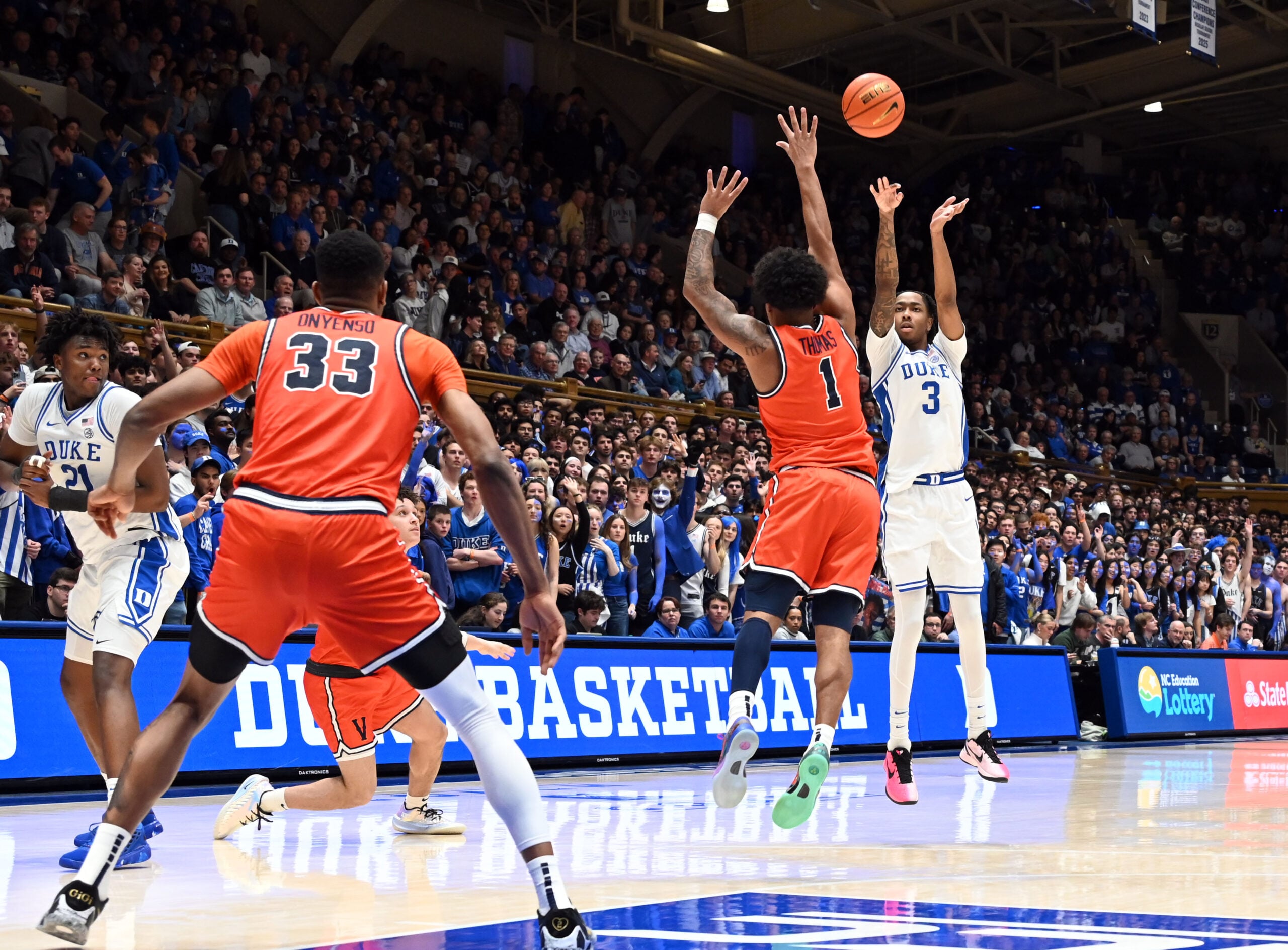 Feb 28, 2026; Durham, North Carolina, USA; Duke Blue Devils forward Isaiah Evans (3) shoots over Virginia Cavaliers guard Malik Thomas (1) during the second half at Cameron Indoor Stadium. Duke won 77-51. Mandatory Credit: Rob Kinnan-Imagn Images