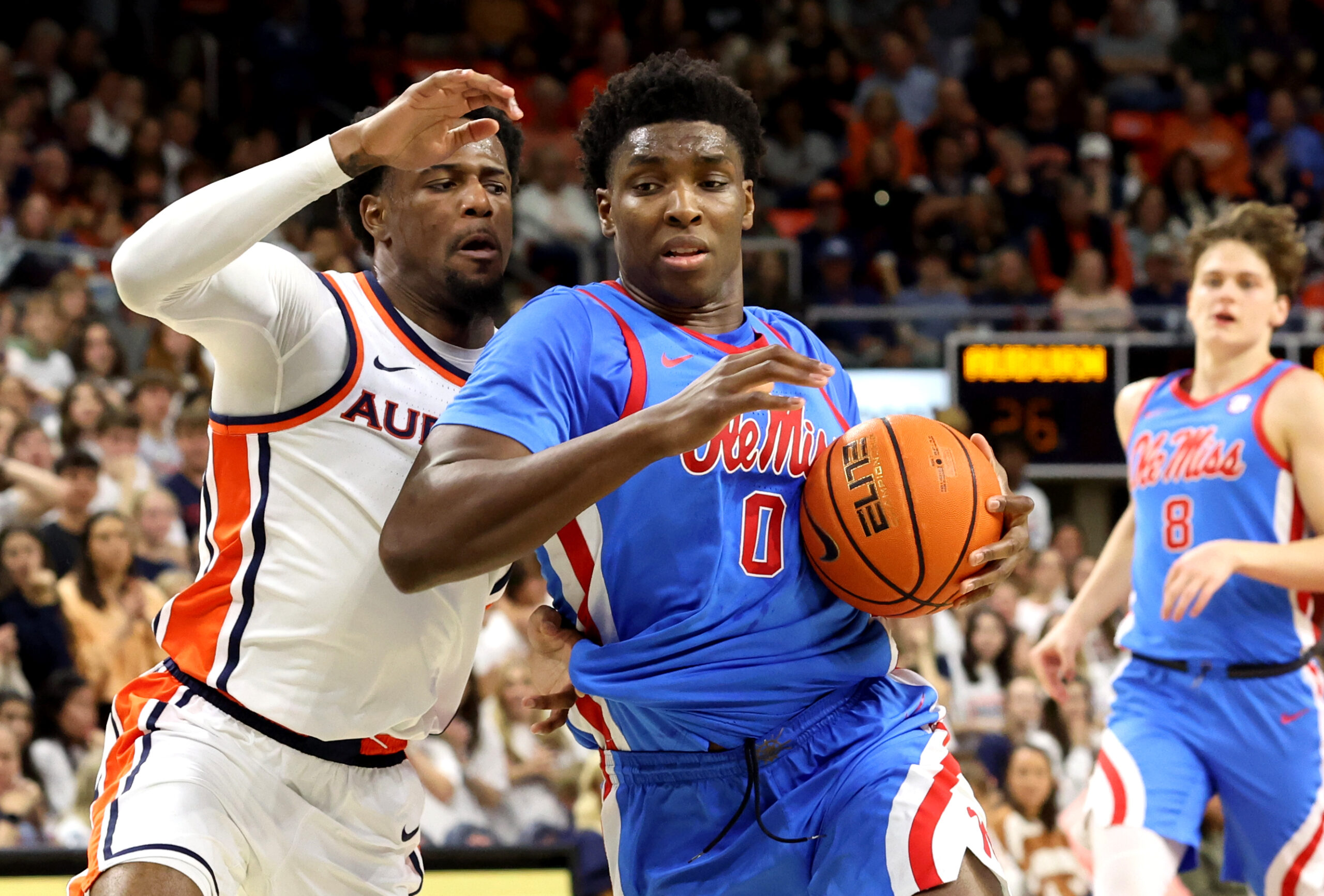 Feb 28, 2026; Auburn, Alabama, USA;  Mississippi Rebels forward Malik Dia (0) gets tangled up with Auburn Tigers guard Kevin Overton (1) during the first half at Neville Arena. Mandatory Credit: John Reed-Imagn Images