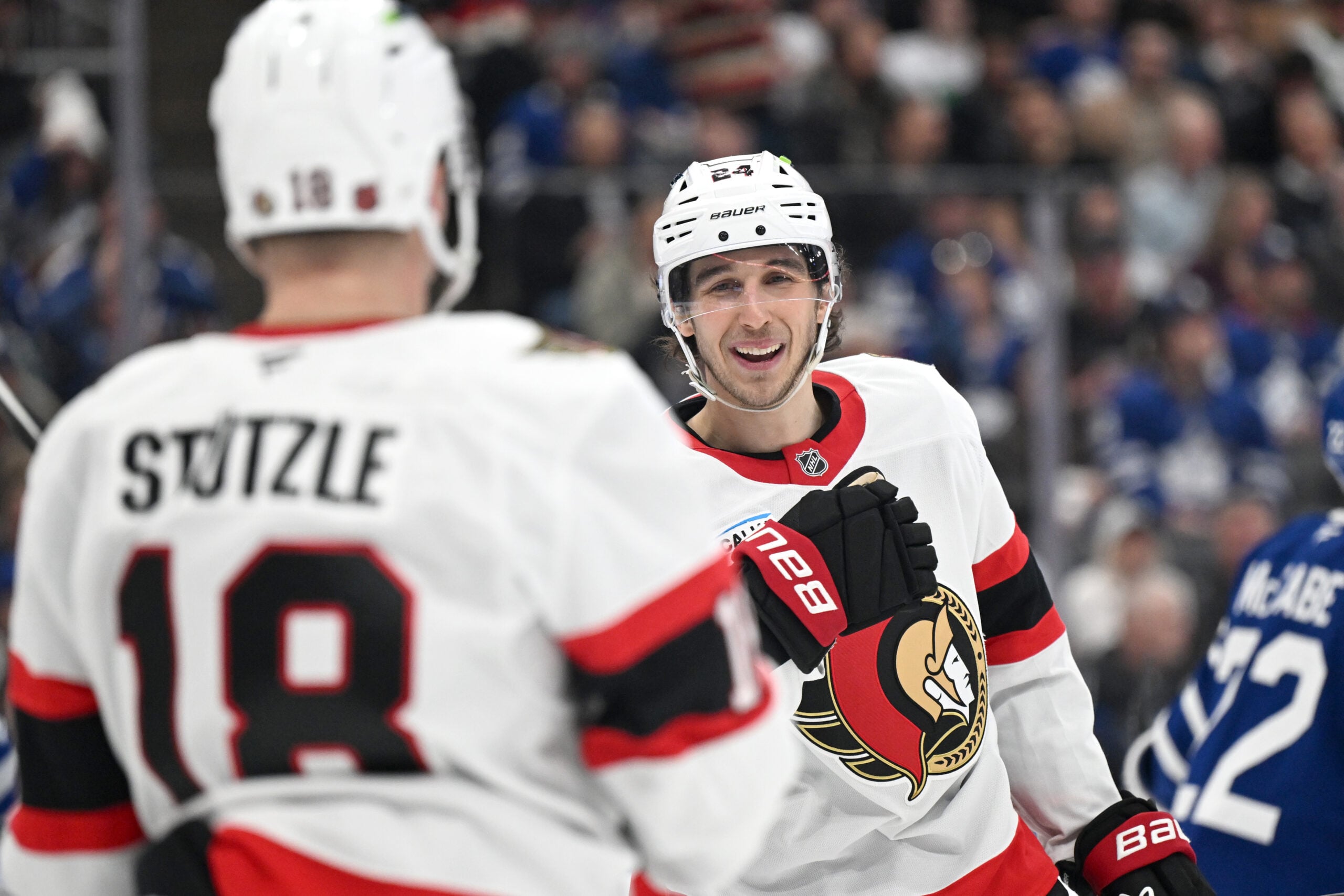 Feb 28, 2026; Toronto, Ontario, CAN;   Ottawa Senators forward Dylan Cozens (24) celebrates with forward Tim Stutzle (18) after scoring a goal against the Toronto Maple Leafs in the second period at Scotiabank Arena. Mandatory Credit: Dan Hamilton-Imagn Images