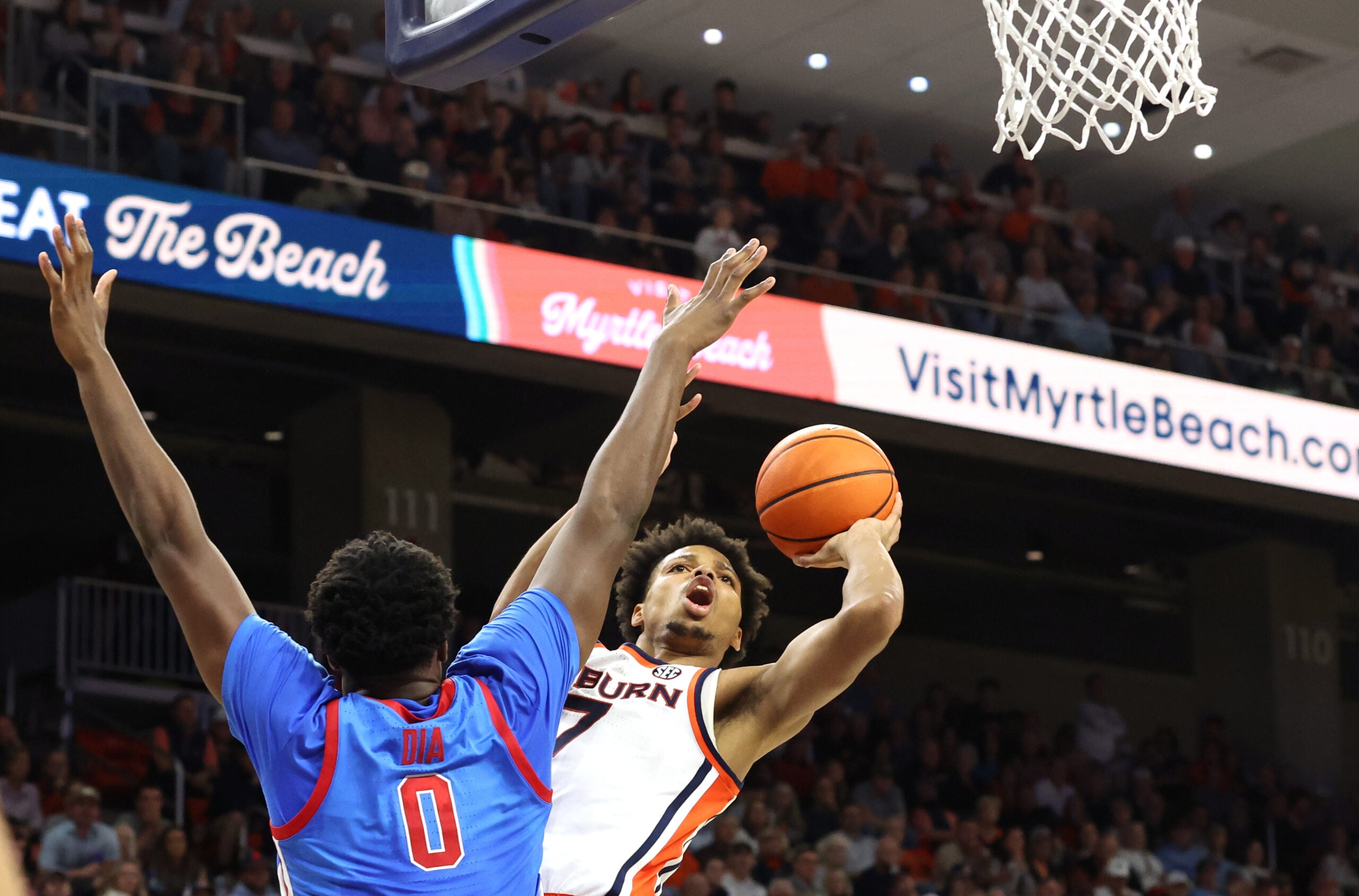 Feb 28, 2026; Auburn, Alabama, USA; Auburn Tigers guard Keyshawn Hall (7) takes a shot against Mississippi Rebels forward Malik Dia (0) during the second half at Neville Arena. Mandatory Credit: John Reed-Imagn Images