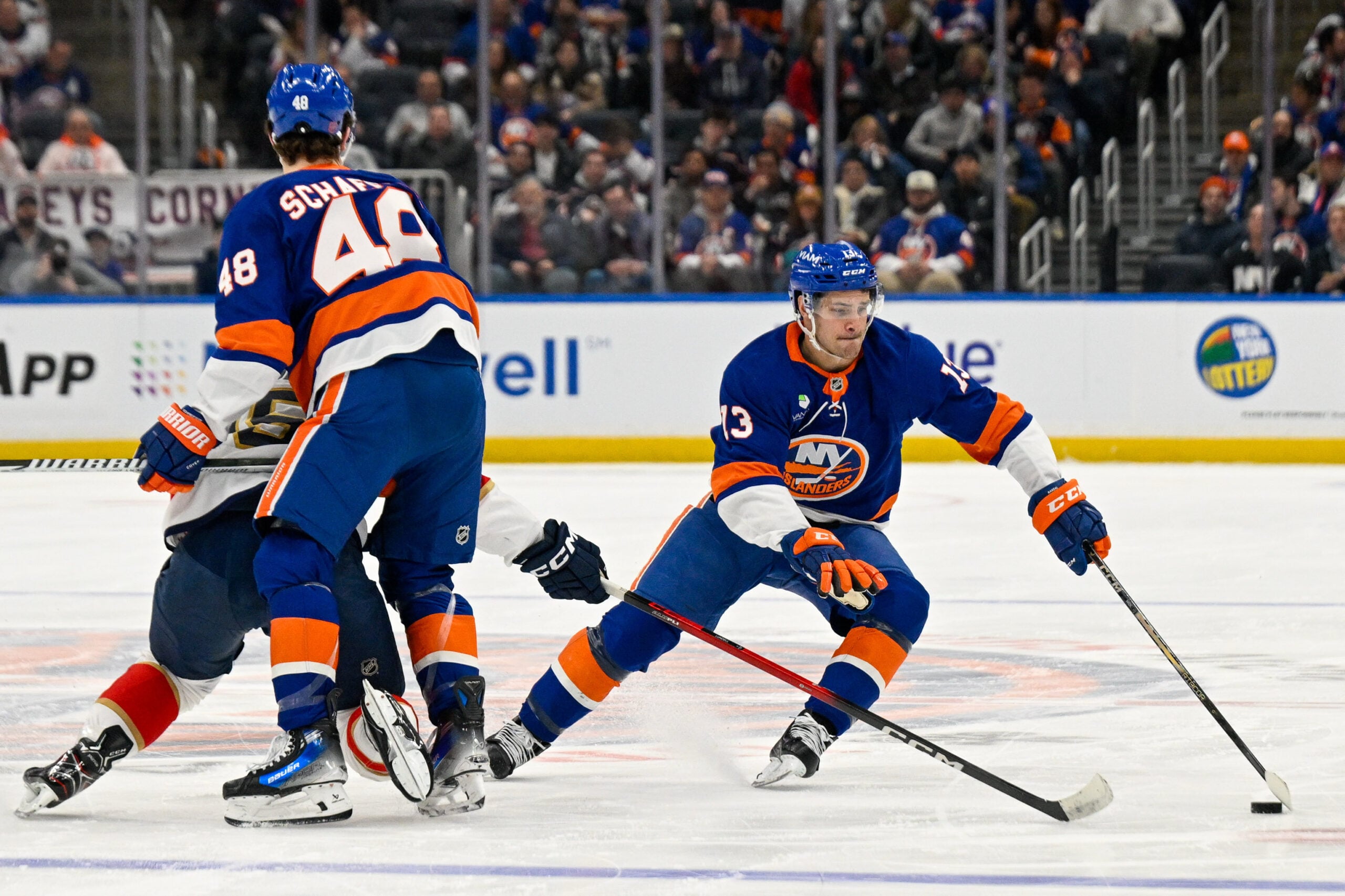 Mar 1, 2026; Elmont, New York, USA;  New York Islanders center Mathew Barzal (13) skates around New York Islanders defenseman Matthew Schaefer (48) against the Florida Panthers during the first period at UBS Arena. Mandatory Credit: Dennis Schneidler-Imagn Images