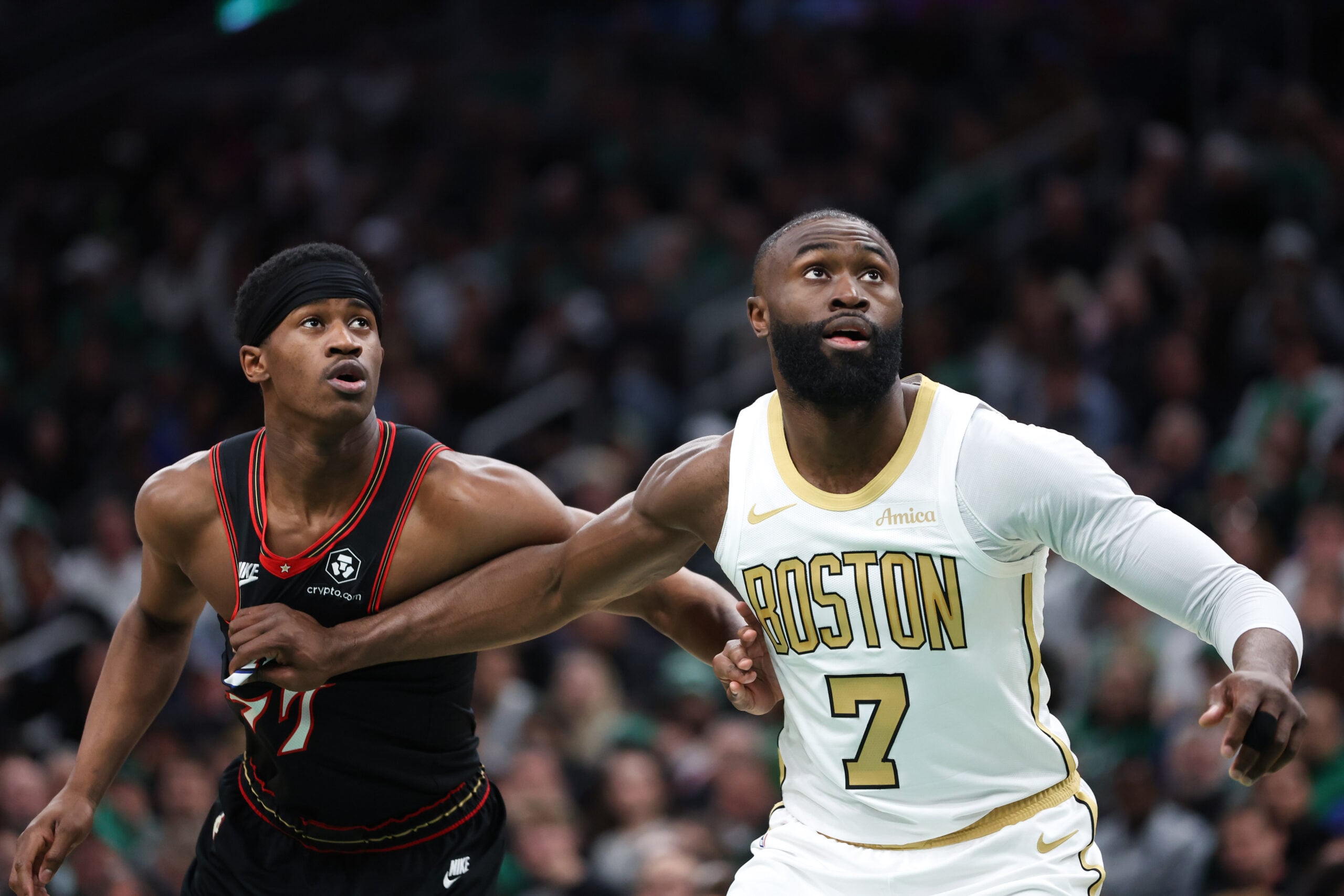 Mar 1, 2026; Boston, Massachusetts, USA; Boston Celtics forward Jaylen Brown (7) boxes out Philadelphia 76ers guard VJ Edgecombe (77) during the first half at TD Garden. Mandatory Credit: Paul Rutherford-Imagn Images