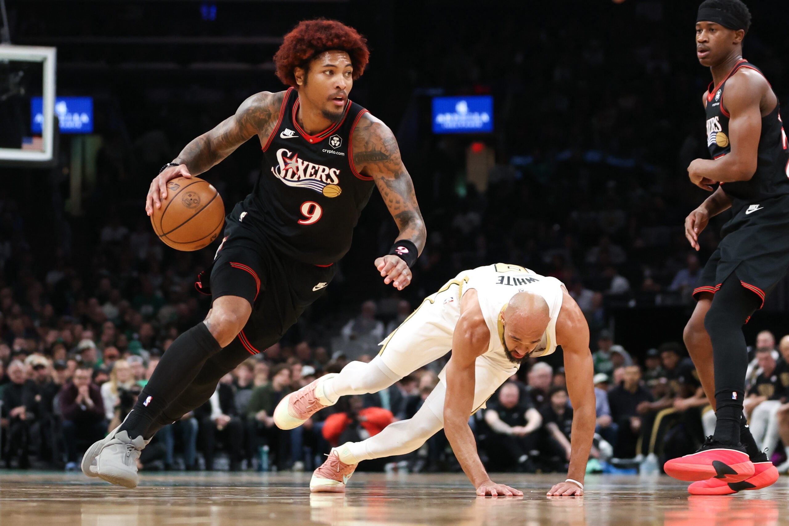 Mar 1, 2026; Boston, Massachusetts, USA; Philadelphia 76ers forward Kelly Oubre Jr (9) drives to the basket during the first half against the Boston Celtics at TD Garden. Mandatory Credit: Paul Rutherford-Imagn Images