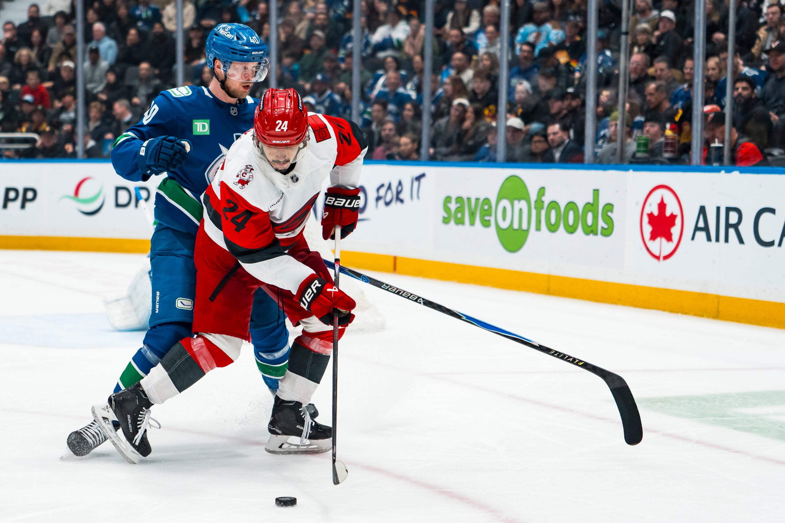 Mar 4, 2026; Vancouver, British Columbia, CAN; Vancouver Canucks forward Elias Pettersson (40) battles with Carolina Hurricanes forward Seth Jarvis (24) in the second at Rogers Arena. Mandatory Credit: Bob Frid-Imagn Images