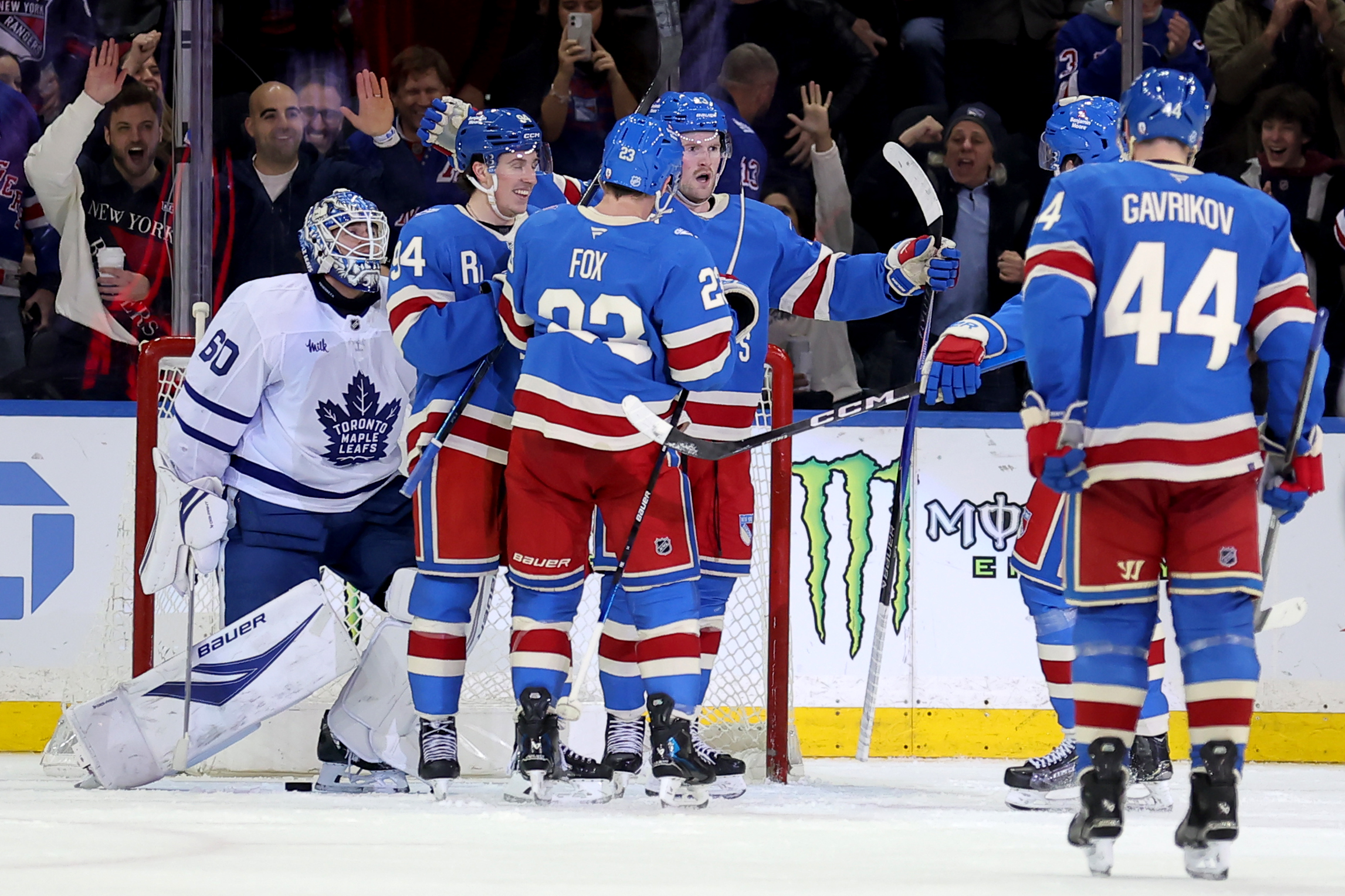 Mar 5, 2026; New York, New York, USA; New York Rangers left wing Alexis Lafreniere (13) celebrates his goal against Toronto Maple Leafs goaltender Joseph Woll (60) with teammates during the third period at Madison Square Garden. Mandatory Credit: Brad Penner-Imagn Images
