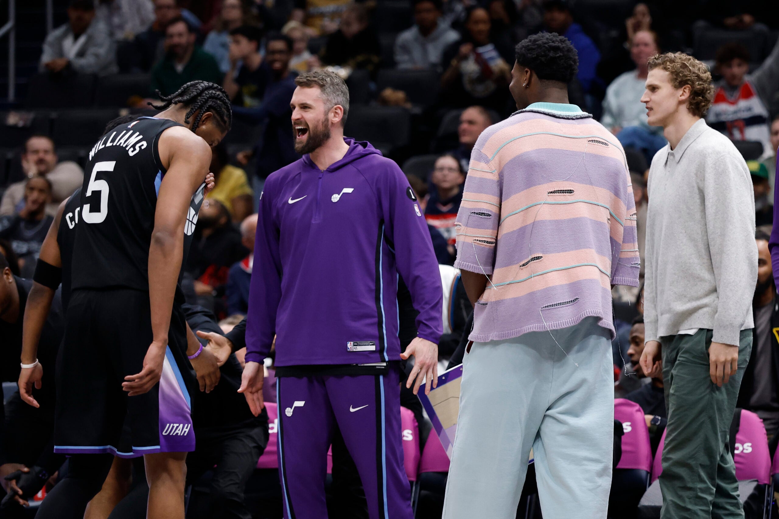 Mar 5, 2026; Washington, District of Columbia, USA; Utah Jazz guard Isaiah Collier (8) and Jazz forward Cody Williams (5) celebrate with teammates on the bench against the Washington Wizards in the second half at Capital One Arena. Mandatory Credit: Geoff Burke-Imagn Images