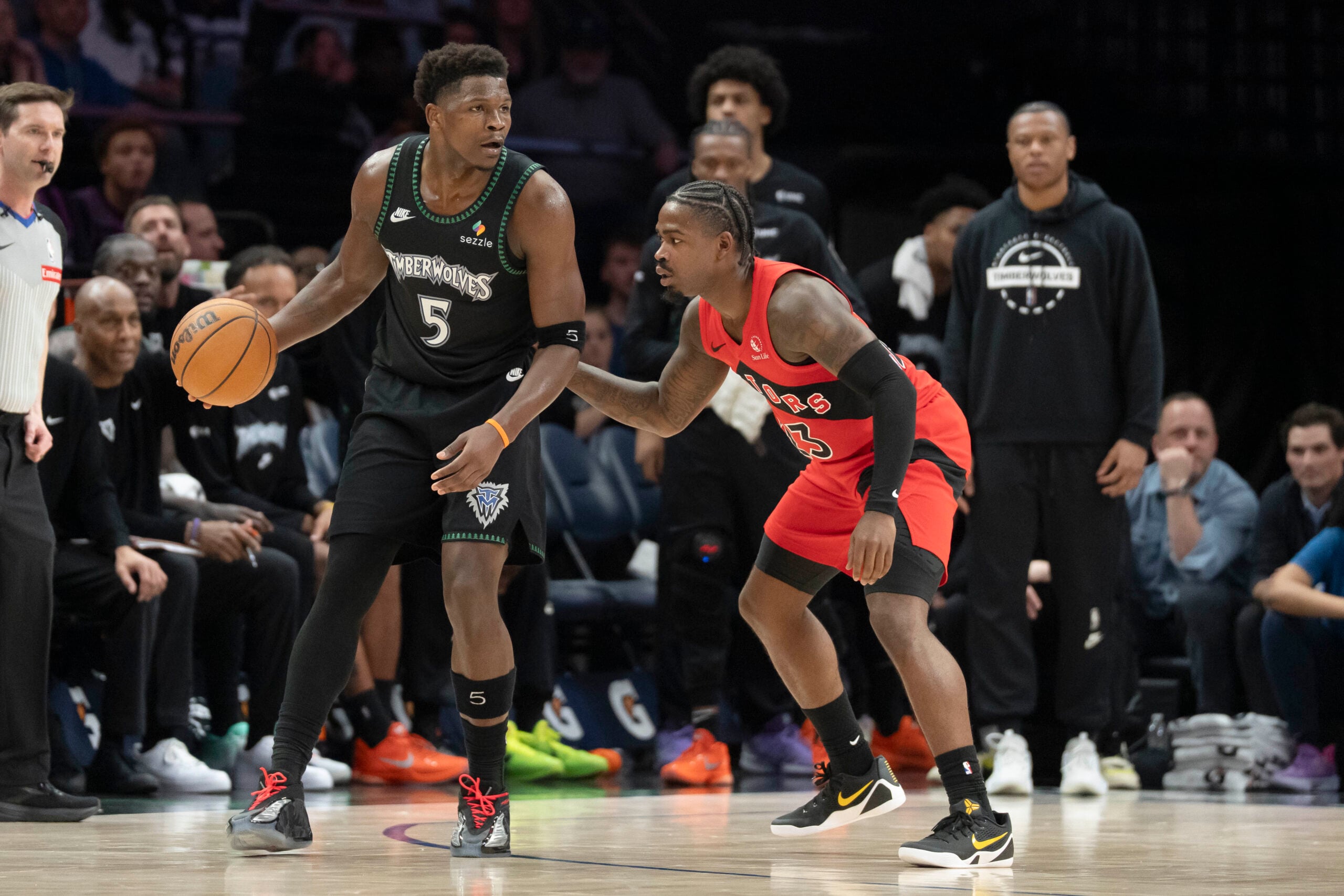 Mar 5, 2026; Minneapolis, Minnesota, USA; Minnesota Timberwolves guard Anthony Edwards (5) dribbles the ball as Toronto Raptors guard Jamal Shead (23) plays defense in the second half at Target Center. Mandatory Credit: Jesse Johnson-Imagn Images