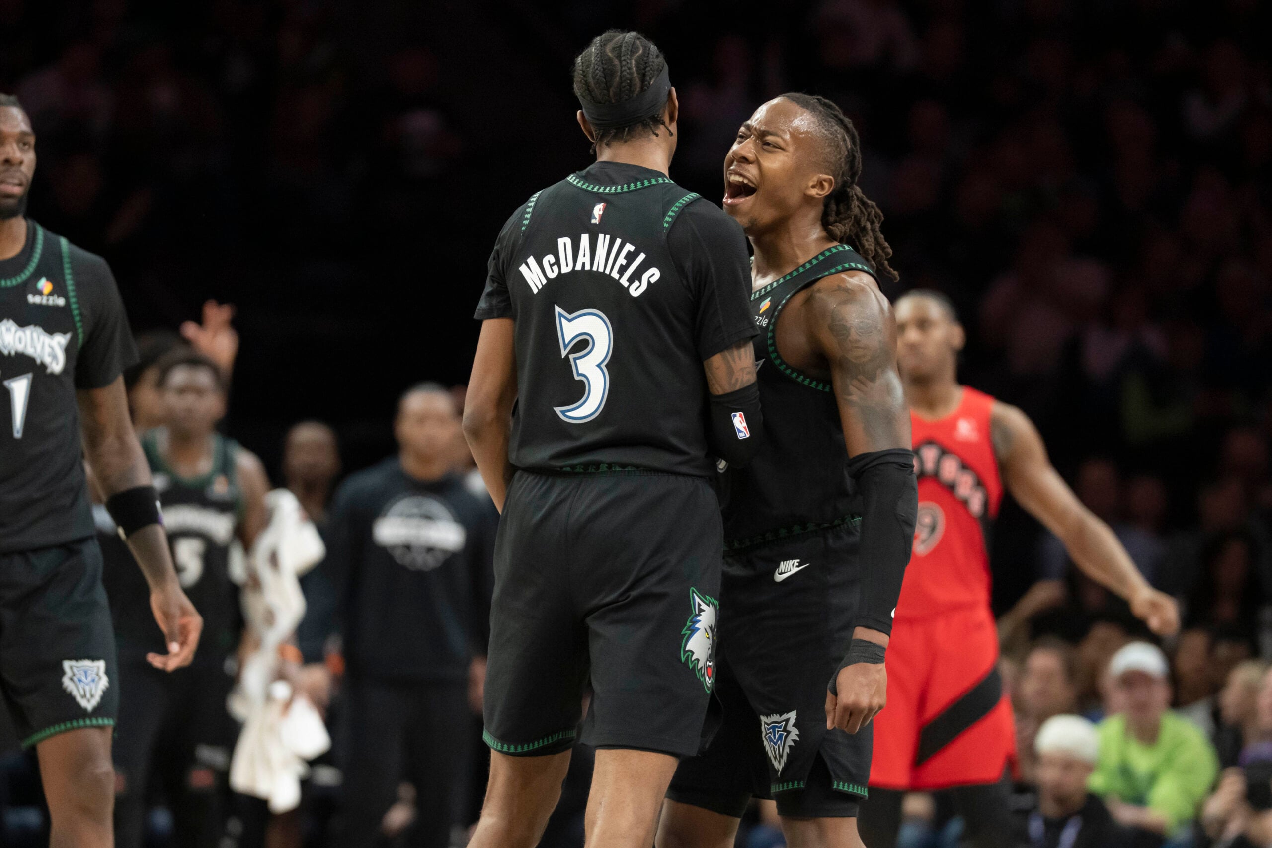 Mar 5, 2026; Minneapolis, Minnesota, USA; Minnesota Timberwolves forward Jaden McDaniels (3) and Minnesota Timberwolves guard Ayo Dosunmu (13) celebrate making a shot against the Toronto Raptors in the second half at Target Center. Mandatory Credit: Jesse Johnson-Imagn Images