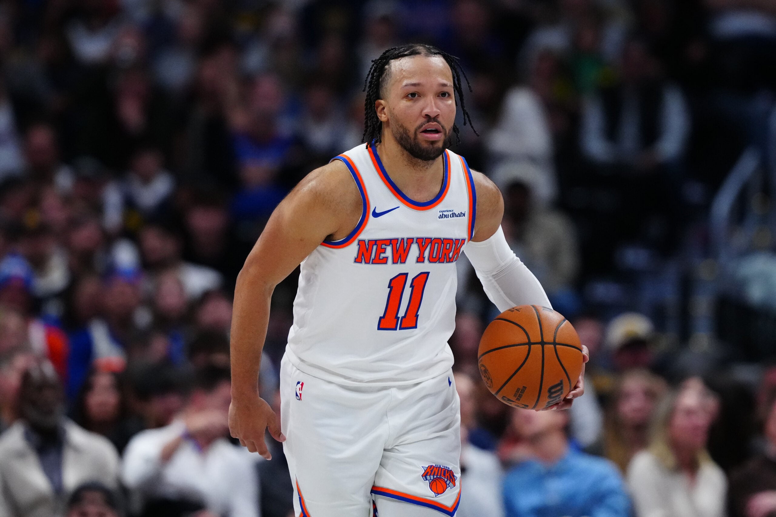 Mar 6, 2026; Denver, Colorado, USA; New York Knicks guard Jalen Brunson (11) controls the ball in the second half against the Denver Nuggets at Ball Arena. Mandatory Credit: Ron Chenoy-Imagn Images