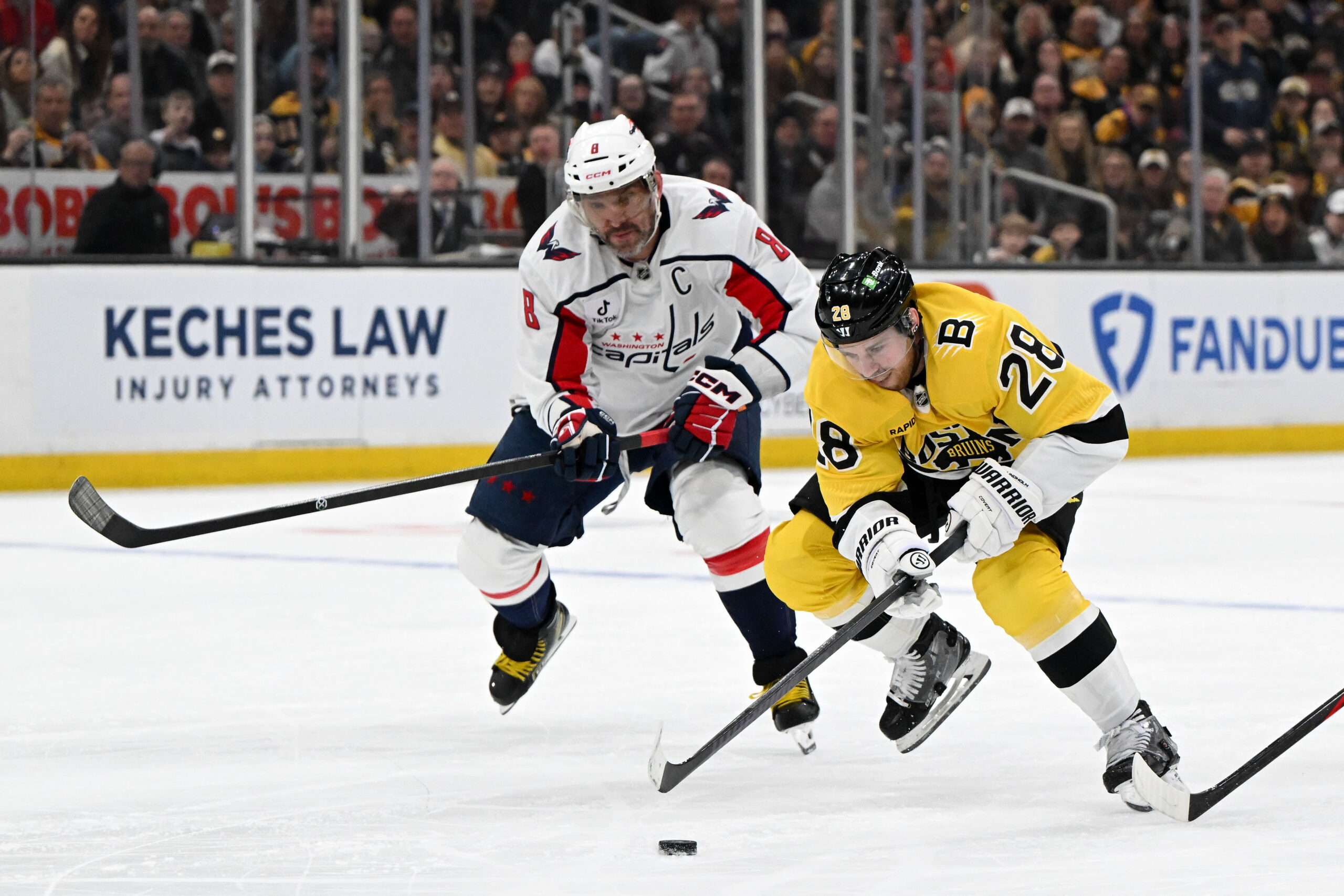Mar 7, 2026; Boston, Massachusetts, USA; Boston Bruins center Elias Lindholm (28) skates against Washington Capitals left wing Alex Ovechkin (8) during the first period at the TD Garden. Mandatory Credit: Brian Fluharty-Imagn Images