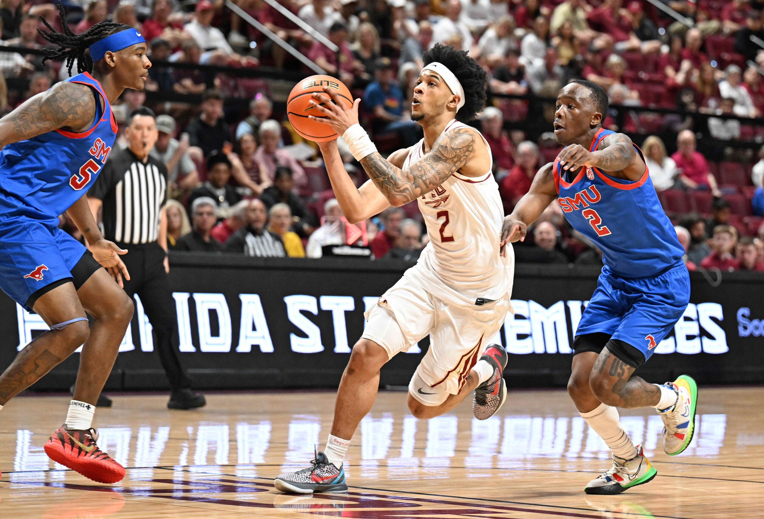 Mar 7, 2026; Tallahassee, Florida, USA; Florida State Seminoles  guard Cam Miles (2) goes up for a shot during the first half against the Southern Methodist Mustangs at Donald L. Tucker Center. Mandatory Credit: Melina Myers-Imagn Images