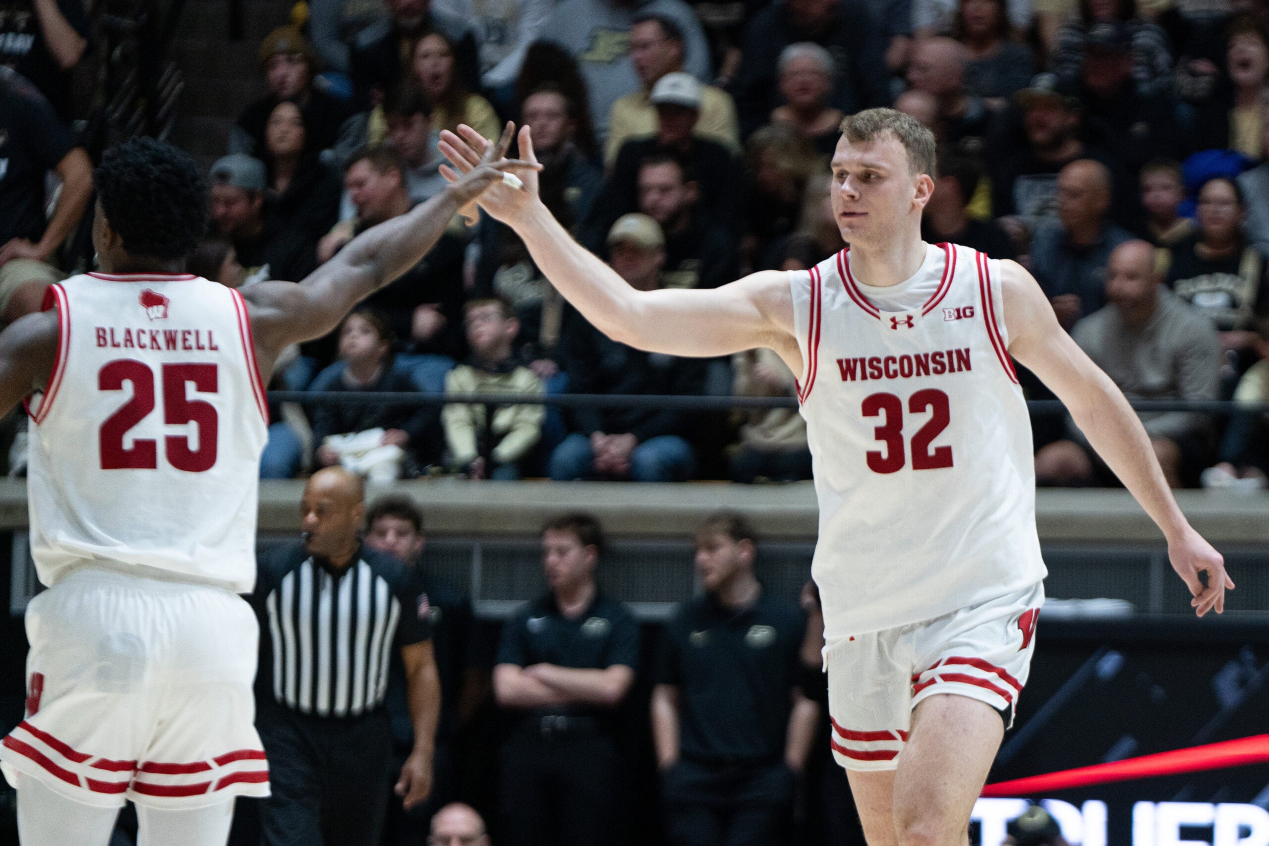 Mar 7, 2026; West Lafayette, Indiana, USA; Wisconsin Badgers forward Aleksas Bieliauskas (32) high fives Wisconsin Badgers guard John Blackwell (25) during the second half at Mackey Arena. Mandatory Credit: Jacob Musselman-Imagn Images