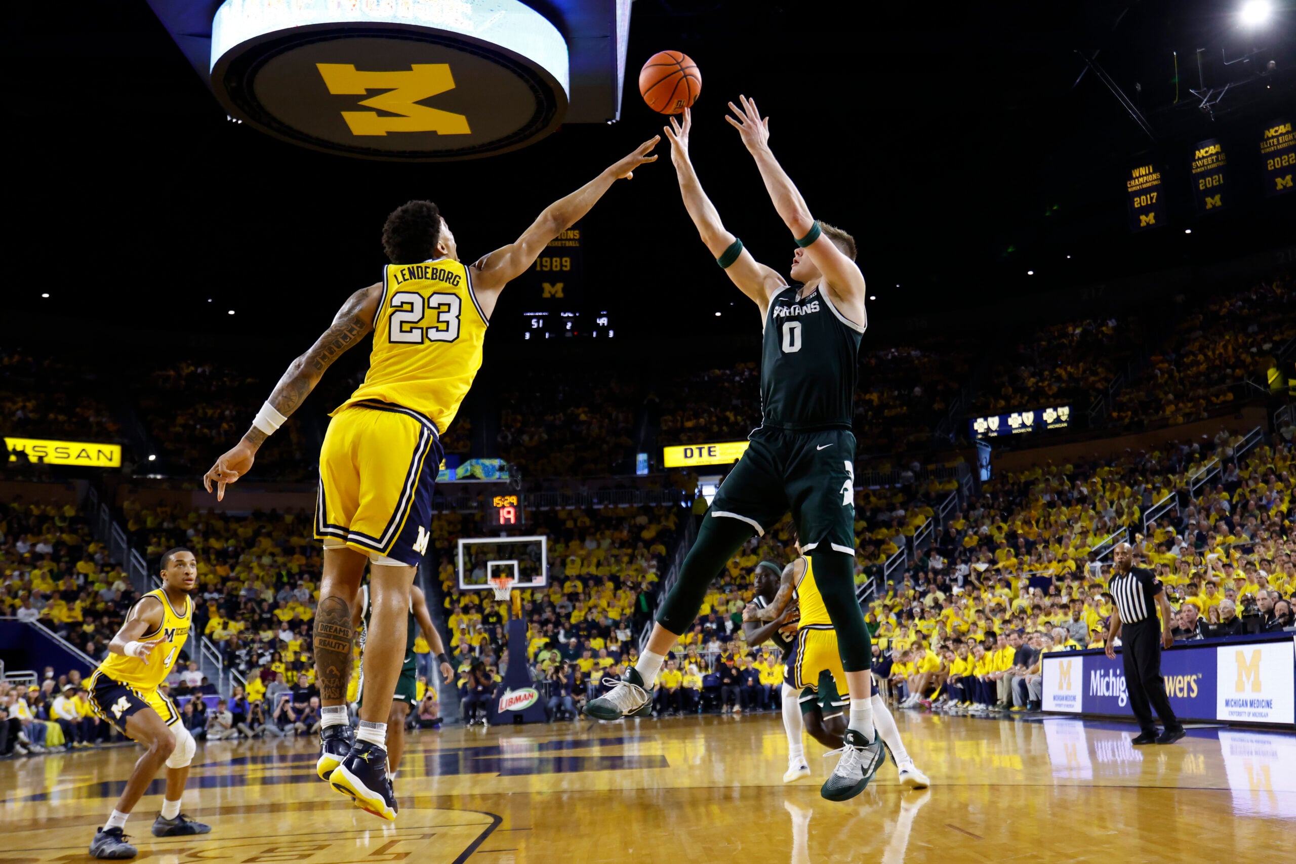 Mar 8, 2026; Ann Arbor, Michigan, USA;  Michigan State Spartans forward Jaxon Kohler (0) shoots on Michigan Wolverines forward Yaxel Lendeborg (23) in the second half at Crisler Center. Mandatory Credit: Rick Osentoski-Imagn Images