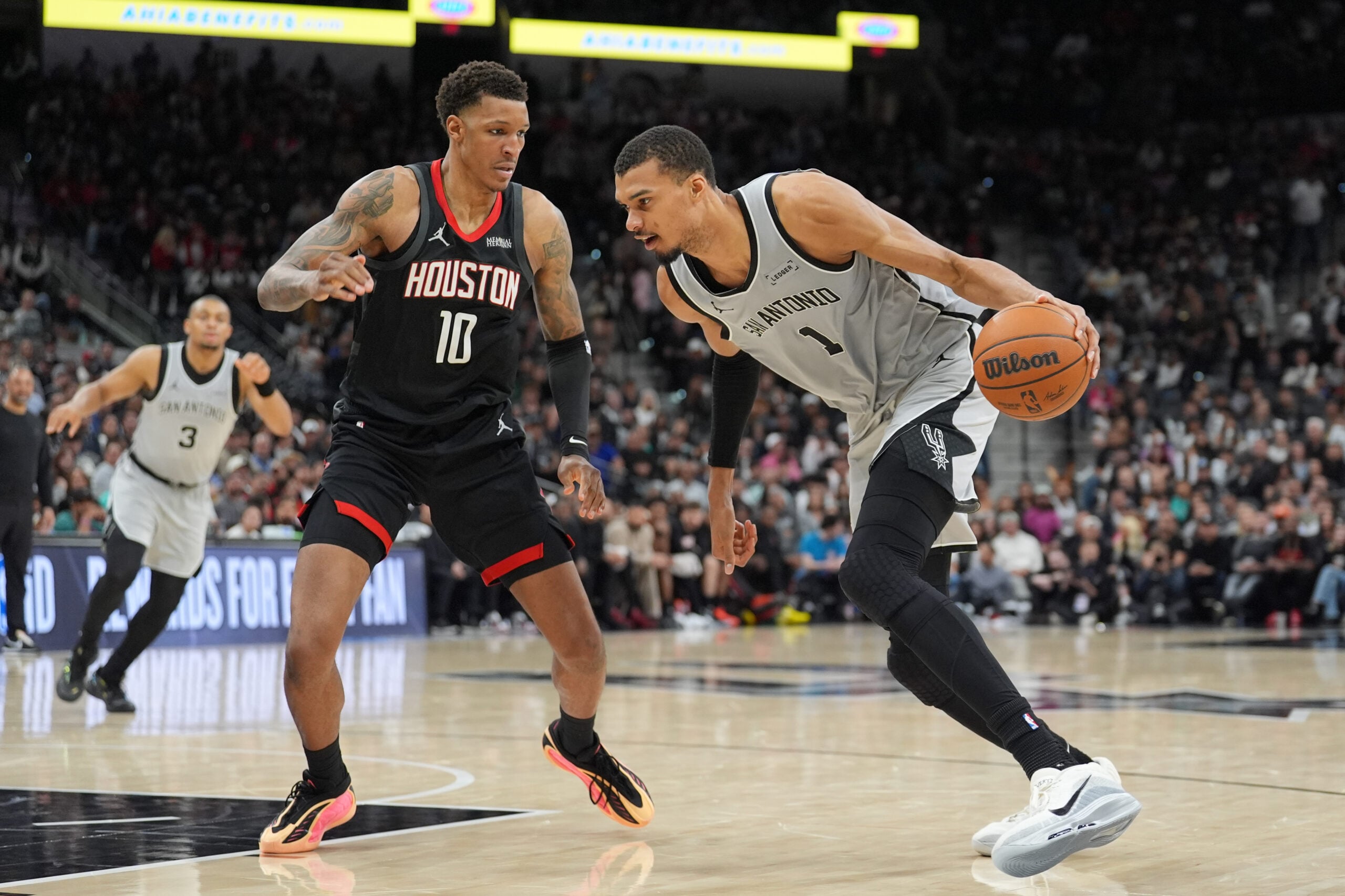 Mar 8, 2026; San Antonio, Texas, USA;  San Antonio Spurs forward Victor Wembanyama (1) dribbles against Houston Rockets forward Jabari Smith Jr. (10) in the second half at Frost Bank Center. Mandatory Credit: Daniel Dunn-Imagn Images