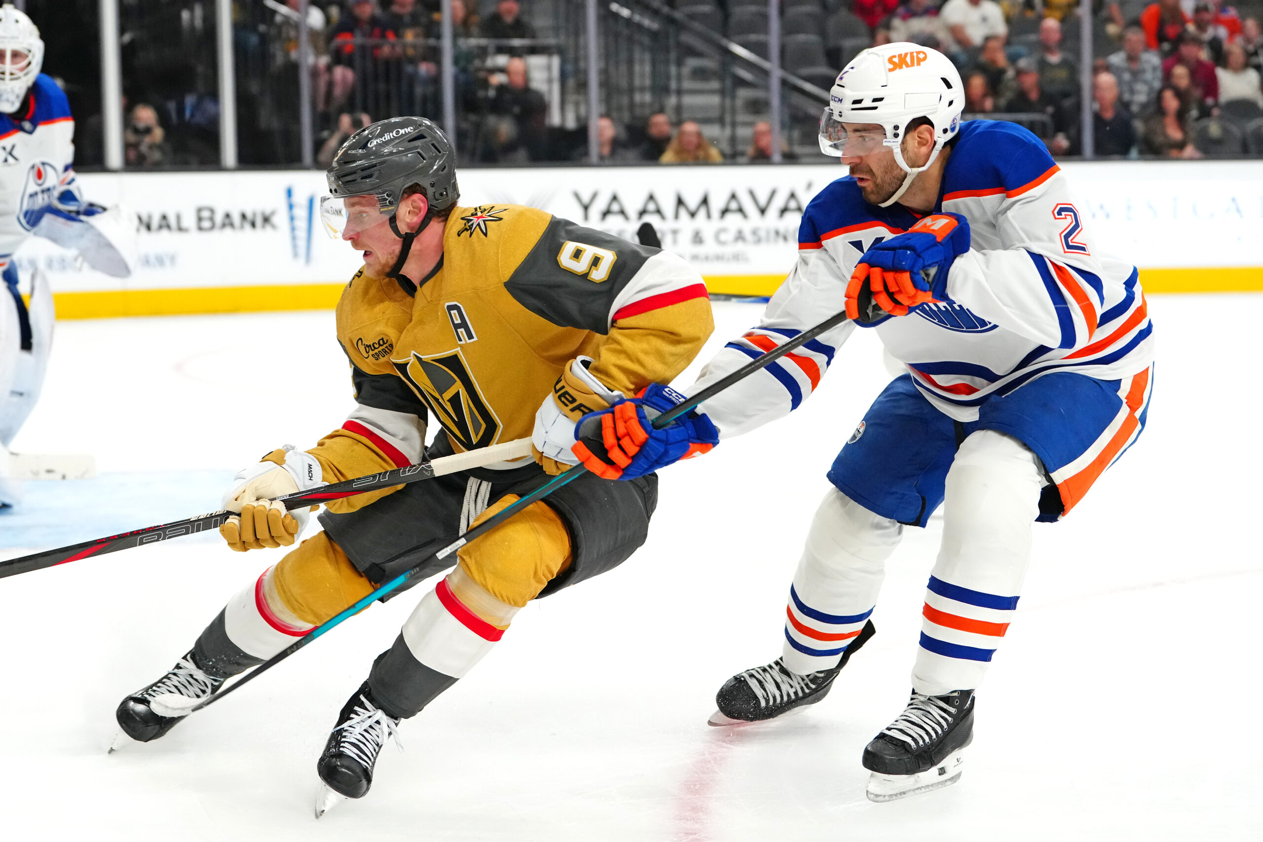 Mar 8, 2026; Las Vegas, Nevada, USA; Vegas Golden Knights center Jack Eichel (9) skates ahead of Edmonton Oilers defenseman Evan Bouchard (2) during the third period at T-Mobile Arena. Mandatory Credit: Stephen R. Sylvanie-Imagn Images