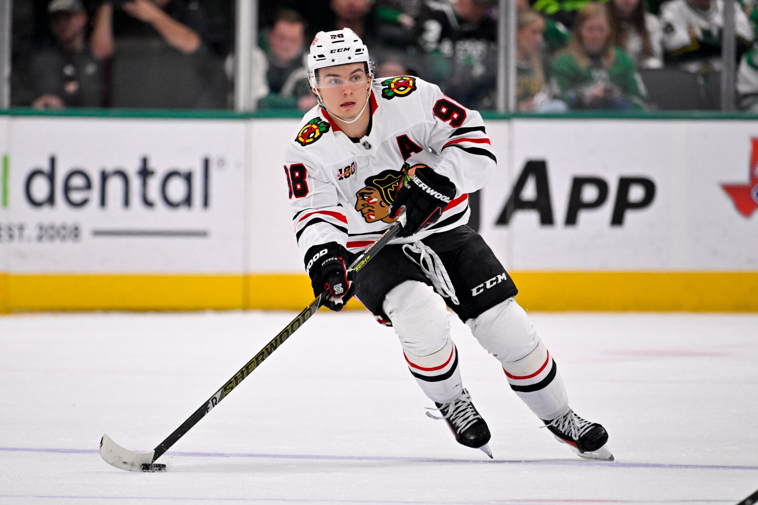 Mar 8, 2026; Dallas, Texas, USA; Chicago Blackhawks center Connor Bedard (98) skates against the Dallas Stars during the game between the Stars and the Blackhawks at American Airlines Center. Mandatory Credit: Jerome Miron-Imagn Images