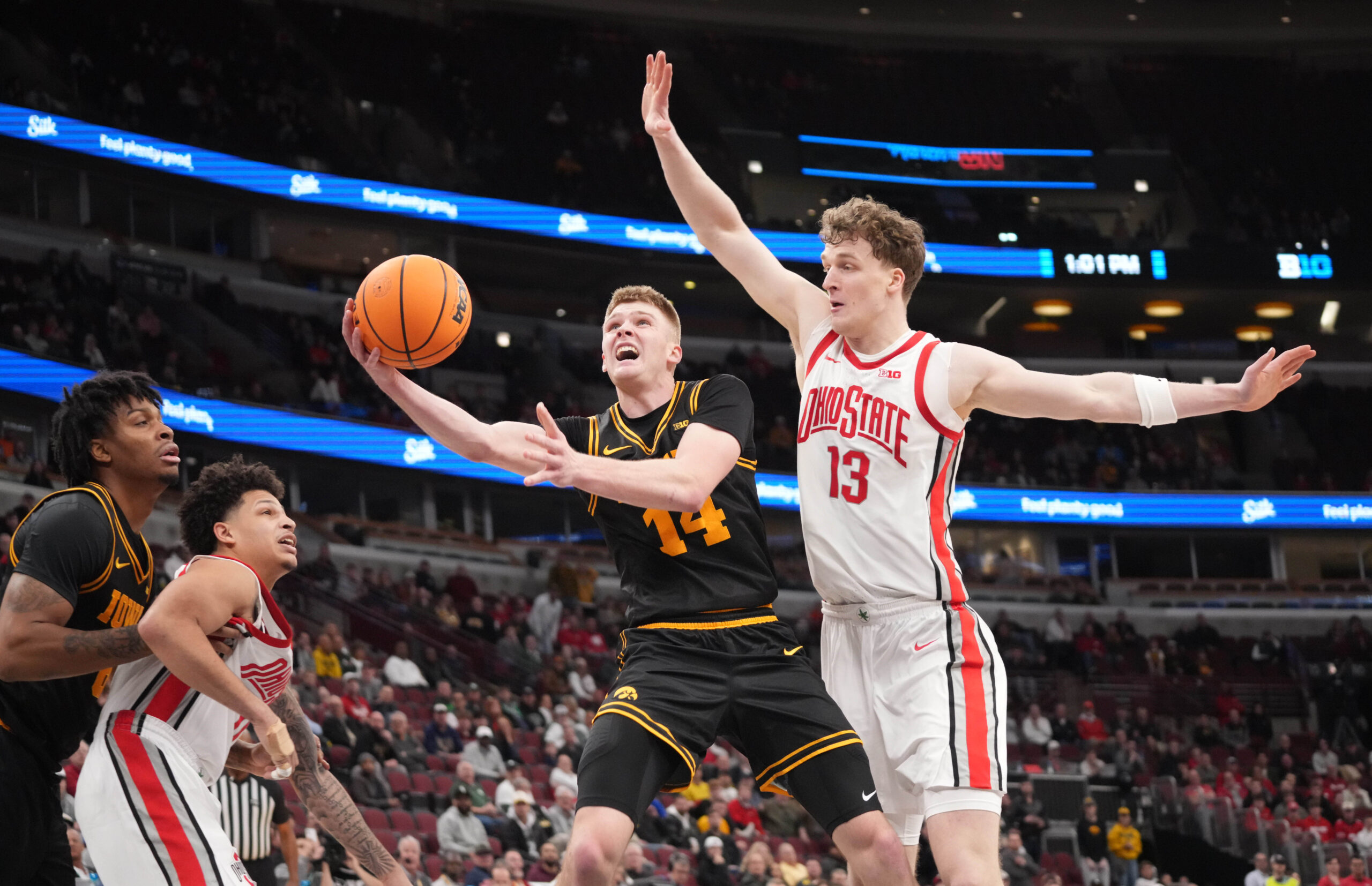 Mar 12, 2026; Chicago, IL, USA; Ohio State Buckeyes center Christoph Tilly (13) defends Iowa Hawkeyes guard Bennett Stirtz (14) during the second half at United Center. Mandatory Credit: David Banks-Imagn Images