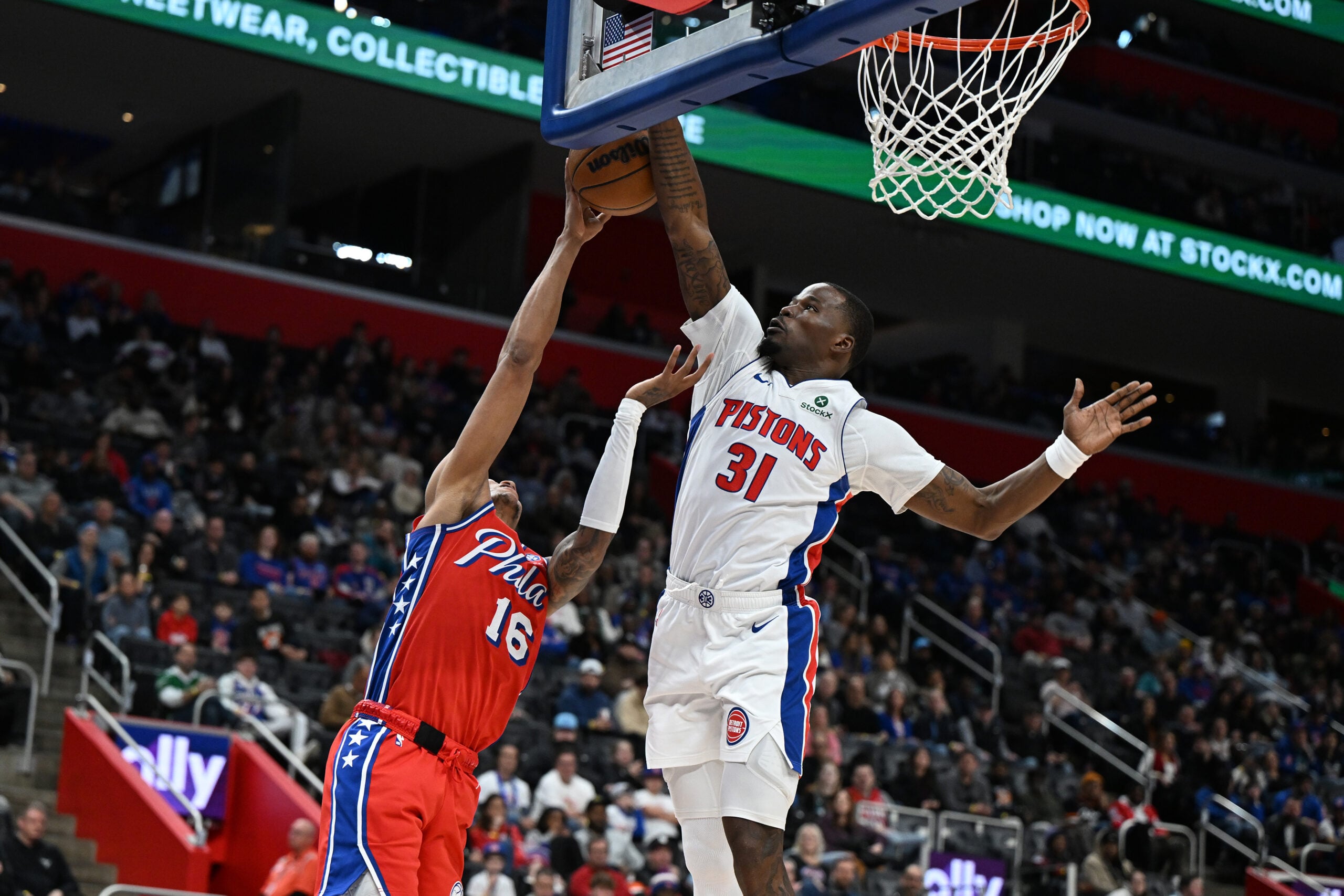 Mar 12, 2026; Detroit, Michigan, USA; Detroit Pistons guard Javonte Green (31) blocks a shot by Philadelphia 76ers forward Marjon Beauchamp (16) in the second half at Little Caesars Arena. Mandatory Credit: Lon Horwedel-Imagn Images