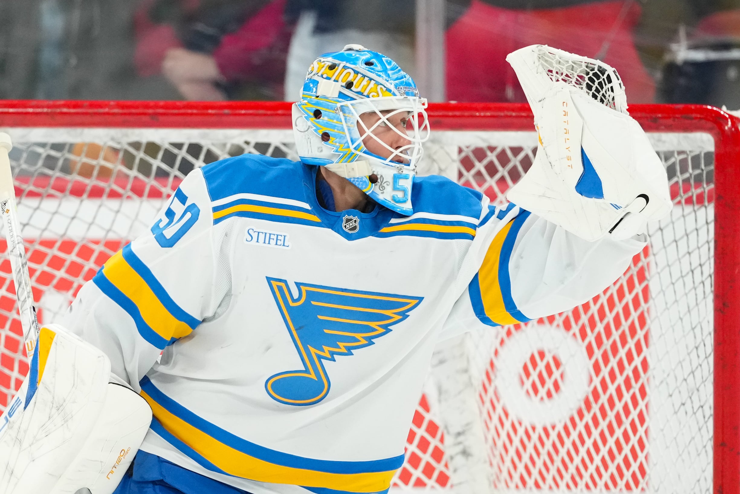Mar 12, 2026; Raleigh, North Carolina, USA;  St. Louis Blues goaltender Jordan Binnington (50) looks at the puck in his glove during the warmups before the game against the Carolina Hurricanes at Lenovo Center. Mandatory Credit: James Guillory-Imagn Images