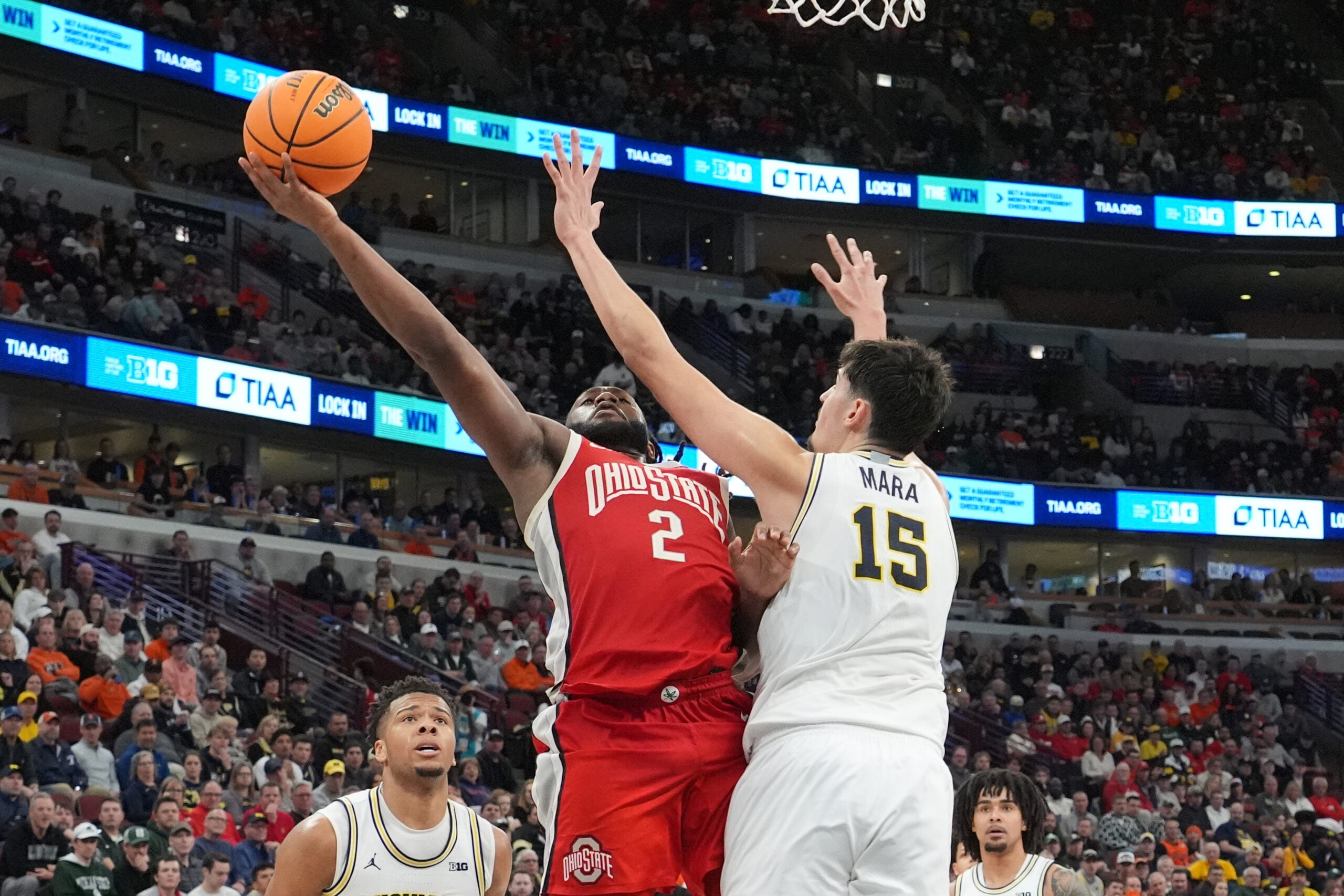 Mar 13, 2026; Chicago, IL, USA; Michigan Wolverines center Aday Mara (15) defends Ohio State Buckeyes guard Bruce Thornton (2) during the second half at United Center. Mandatory Credit: David Banks-Imagn Images
