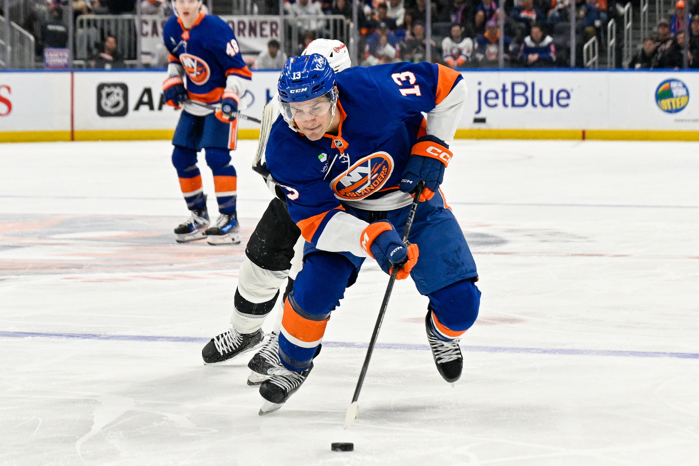 Mar 13, 2026; Elmont, New York, USA; New York Islanders center Mathew Barzal (13) skated with the puck against the Los Angeles Kings during the second period at UBS Arena. Mandatory Credit: Dennis Schneidler-Imagn Images