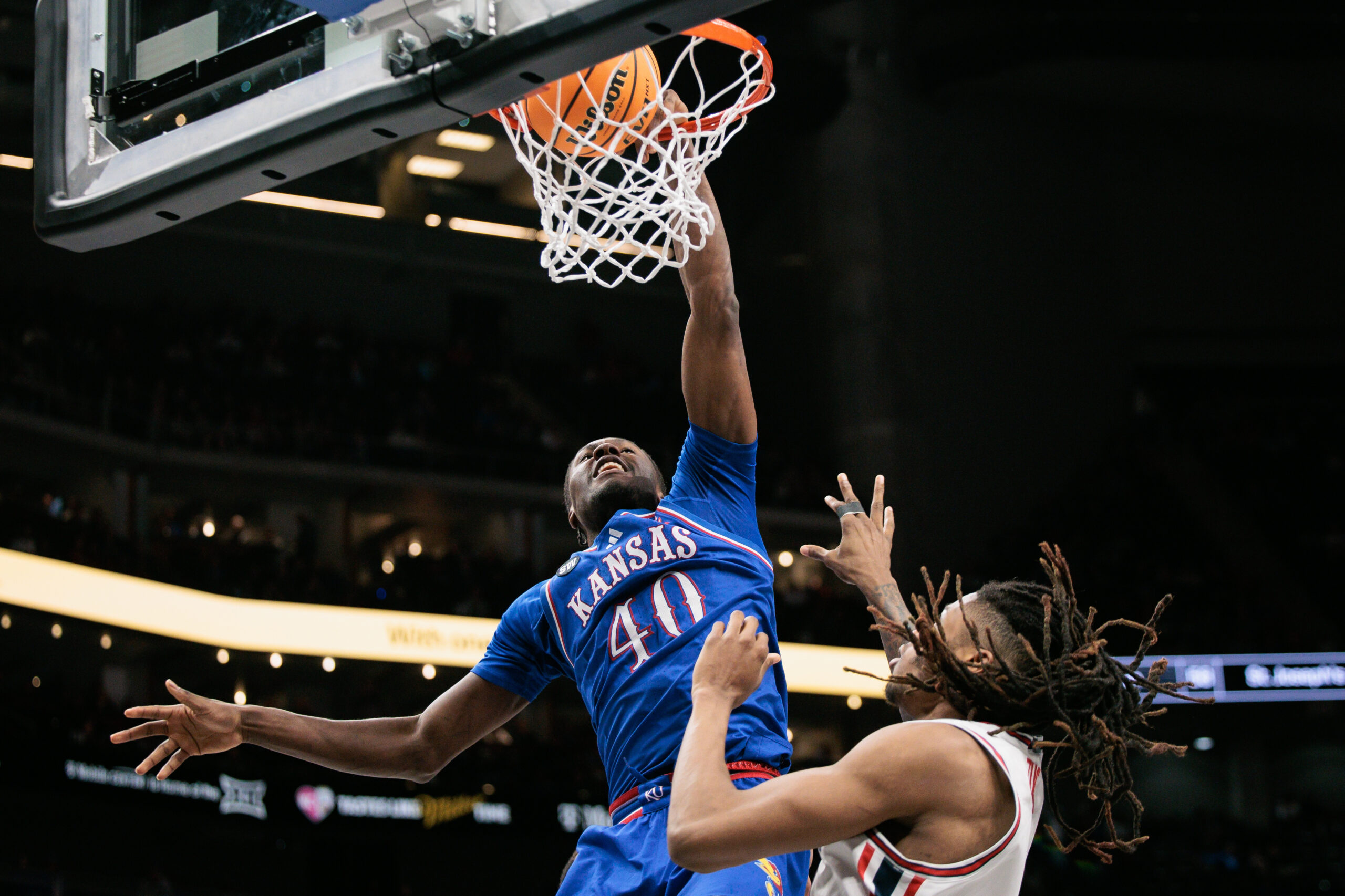 Mar 13, 2026; Kansas City, MO, USA; Kansas Jayhawks forward Flory Bidunga (40) dunks during the second half against the Houston Cougars at T-Mobile Center. Mandatory Credit: William Purnell-Imagn Images